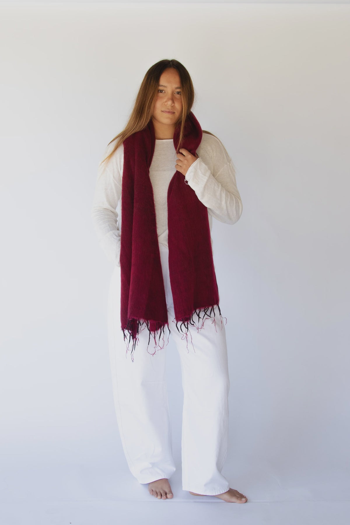 Meet the layer you’ll reach for repeatedly. Worn as a shawl, wrap or scarf, this timeless piece moves effortlessly from slow mornings to cool evenings. Cosy yet refined, it’s made for early yoga flows, windswept beach sunsets, and everything in between.

Lightweight but warming, it’s the ultimate travel companion - wrapping you in comfort and that familiar, at-home feeling wherever you land.

Available in: Mulberry &amp; Hazelnut.

Details
• Approx. 76cm x 188cm
• Cool hand-wash, dry with care
• Handwoven i
