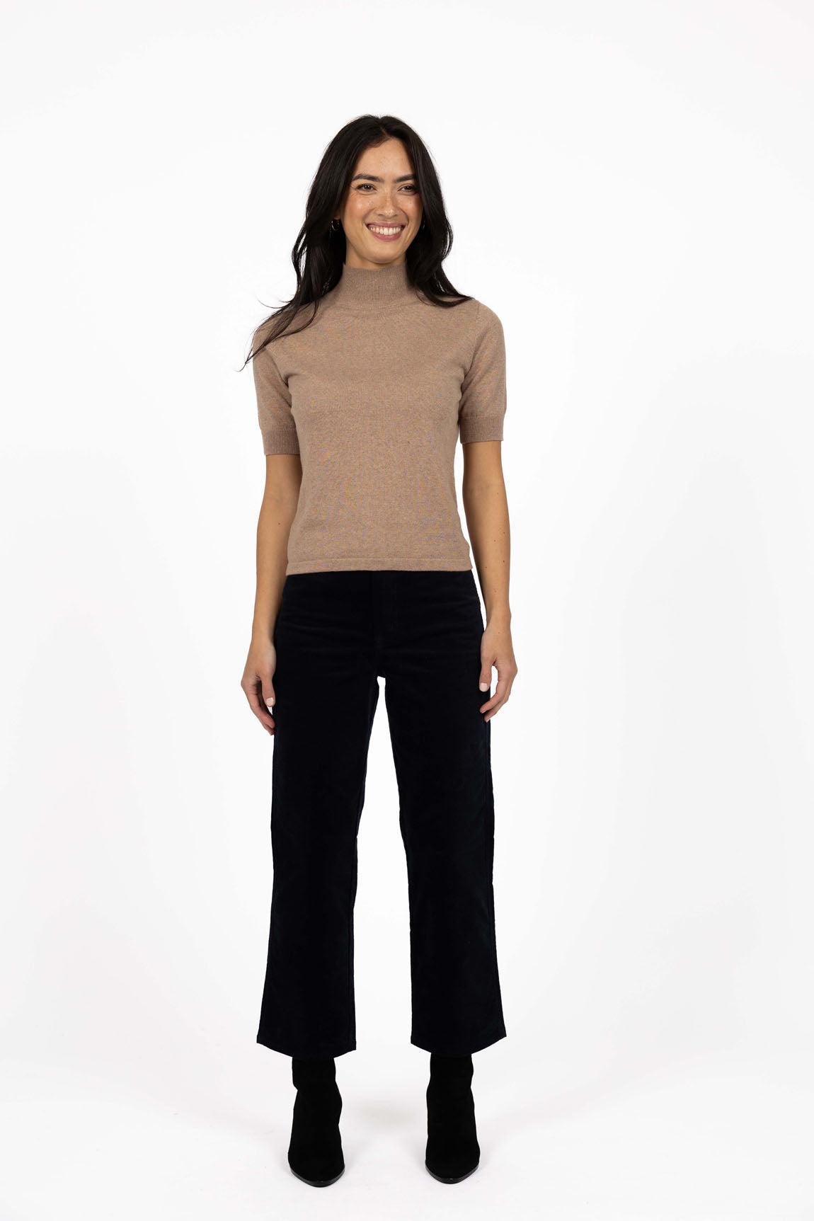 Vera knit top available in black, claret, and hazelnut, crafted from a soft, lightweight cotton/cashmere blend. Designed with a high neckline, sleeves finishing just above the elbow, and ribbed detailing on the neck, cuffs, and hem. The length sits just below the hips, making it ideal for easy tucking and layering. A cosy, non-itch knit perfect for cooler weather, offering a comfortable, true-to-size fit for both work and weekend wear.