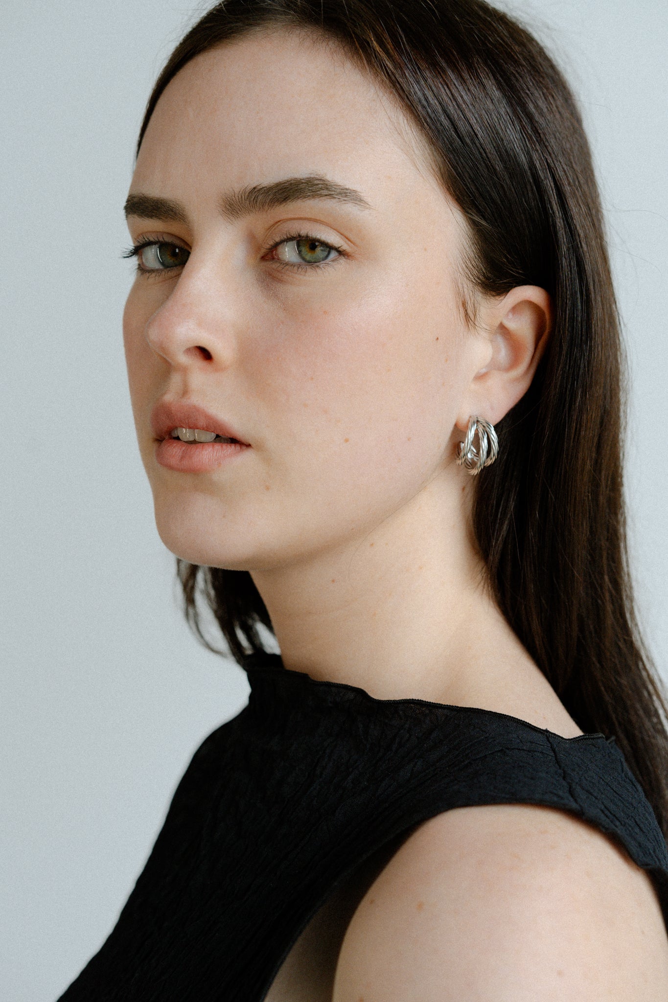 Hadley Hoops by Castel & Co are stainless steel textured hoop earrings available in gold-plated and silver-tone finishes. Designed with a bold yet timeless sculptural silhouette and a light-catching textured finish, they add impact while remaining versatile for everyday wear. Measuring 3 x 1.6 cm with a secure stud closure. Lightweight (9g), waterproof, and hypoallergenic.