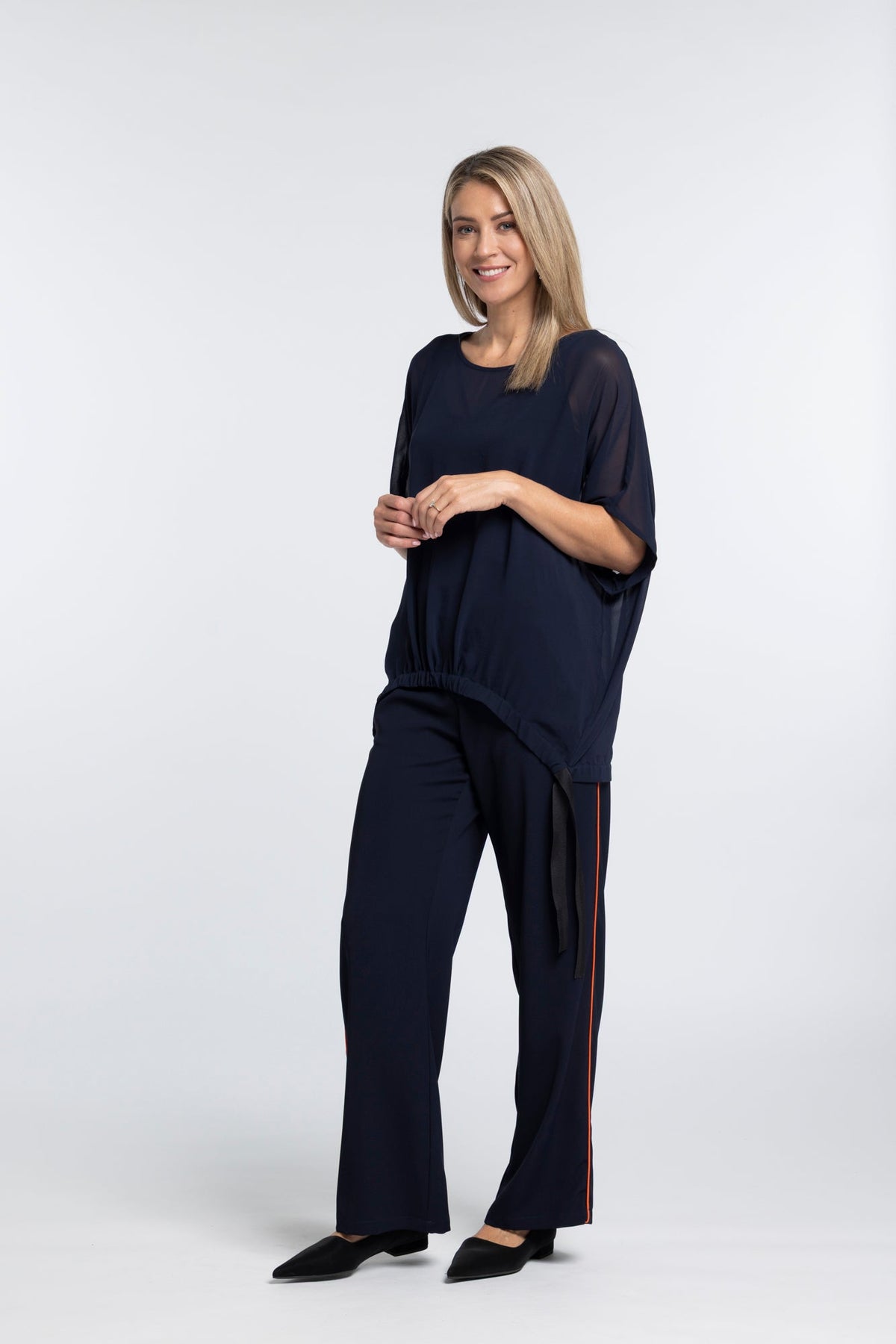 The NES Piped Gin Pants – a best-selling fit with elastic waist, side piping and 32" length. Comfortable, polished and designed for everyday wear.