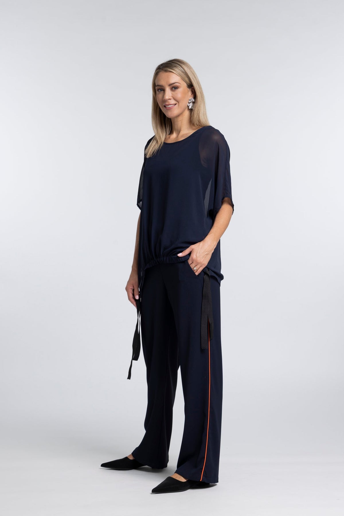 The NES Piped Gin Pants – a best-selling fit with elastic waist, side piping and 32" length. Comfortable, polished and designed for everyday wear.