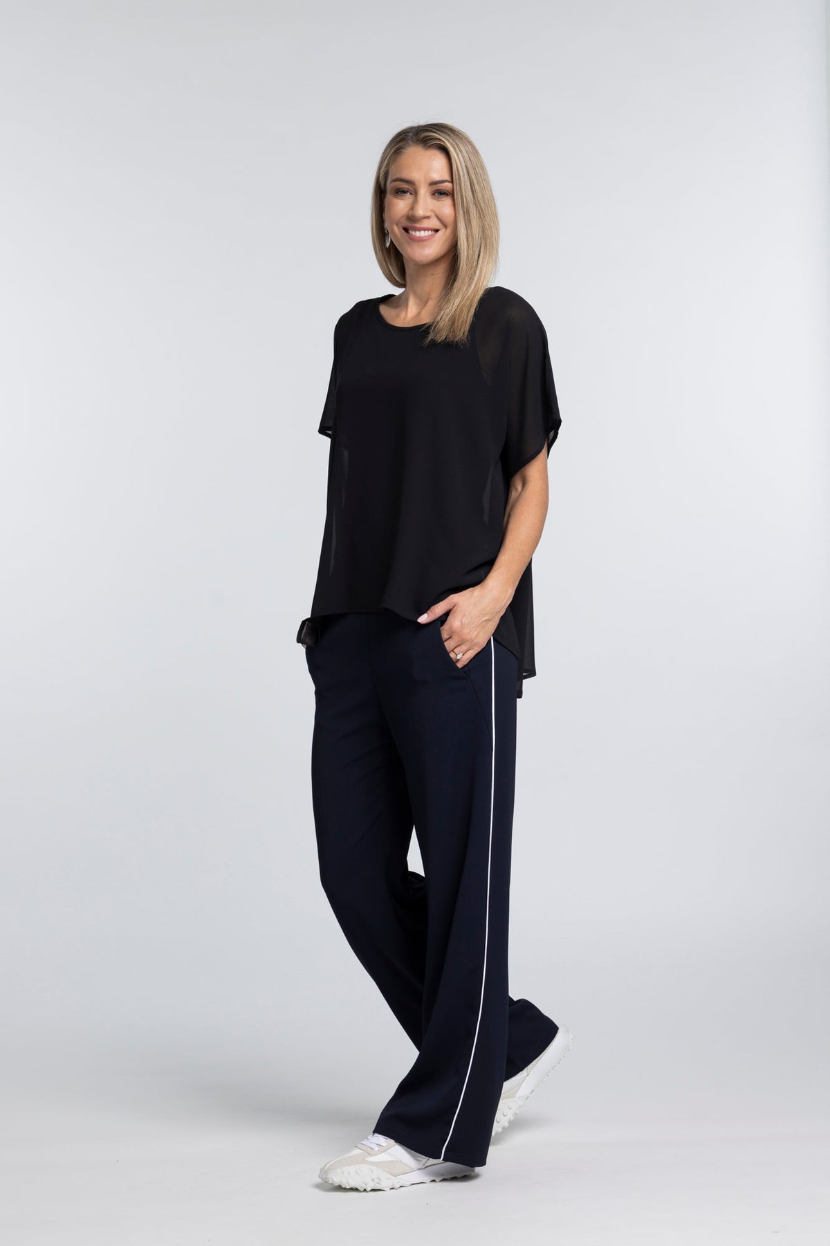 The NES Piped Gin Pants – a best-selling fit with elastic waist, side piping and 32" length. Comfortable, polished and designed for everyday wear.