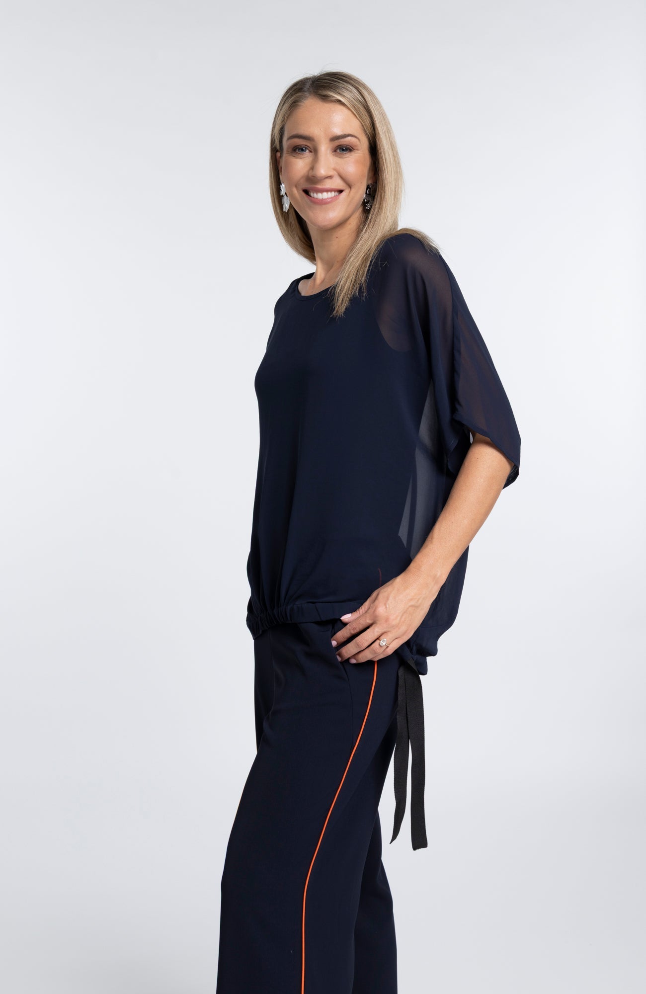 The NES Vanotti Tunic by N-E-S’ best-selling throw-on top with a scoop neckline and adjustable feature hem. Perfect over a Lattice Singlet. NZ made.