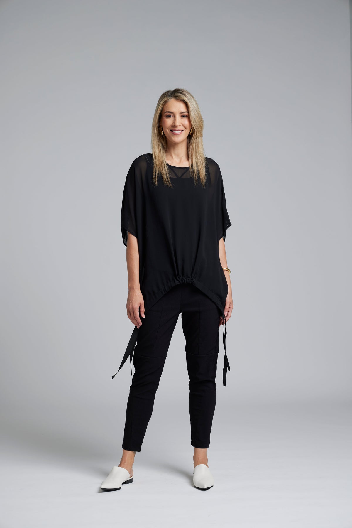 The NES Vanotti Tunic by N-E-S’ best-selling throw-on top with a scoop neckline and adjustable feature hem. Perfect over a Lattice Singlet. NZ made.