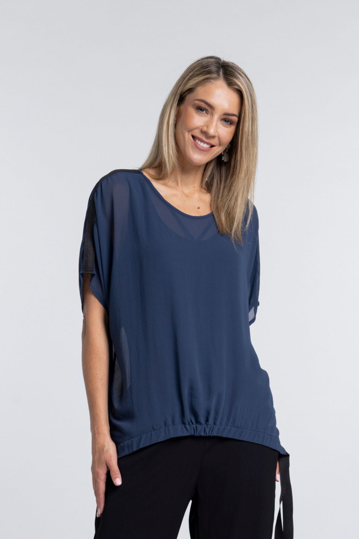 A true N-E-S icon, the Vanotti Tape Top is the piece customers return for season after season. Light, relaxed and beautifully easy to wear, it’s designed to be your effortless throw-on style for days when comfort and simplicity matter most.