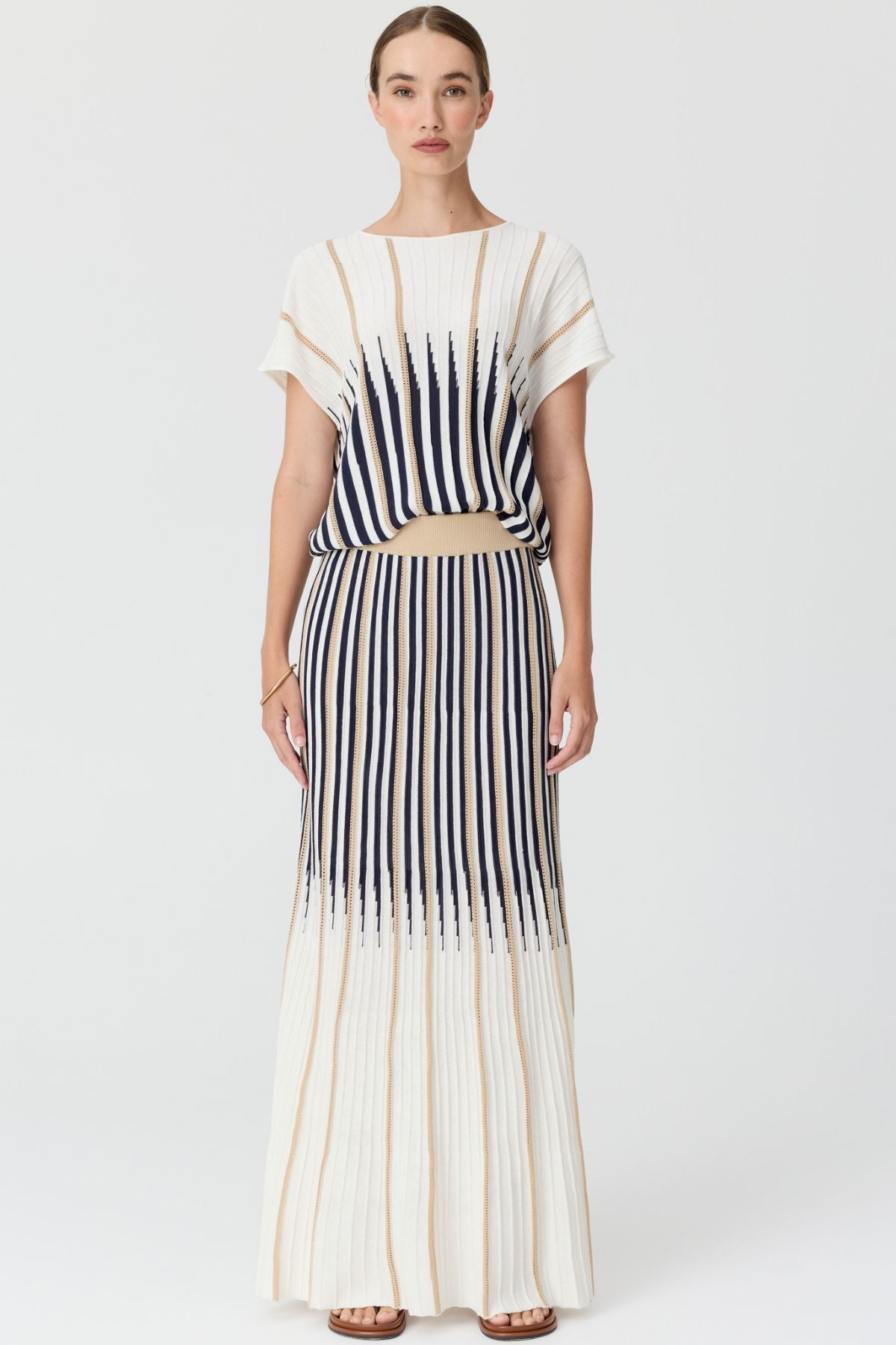 Discover the POL Axil Knit Top curated in racket, featuring signature knit pleats, pointelle contrast stripes and a relaxed, draped fit in a lightweight viscose blend.