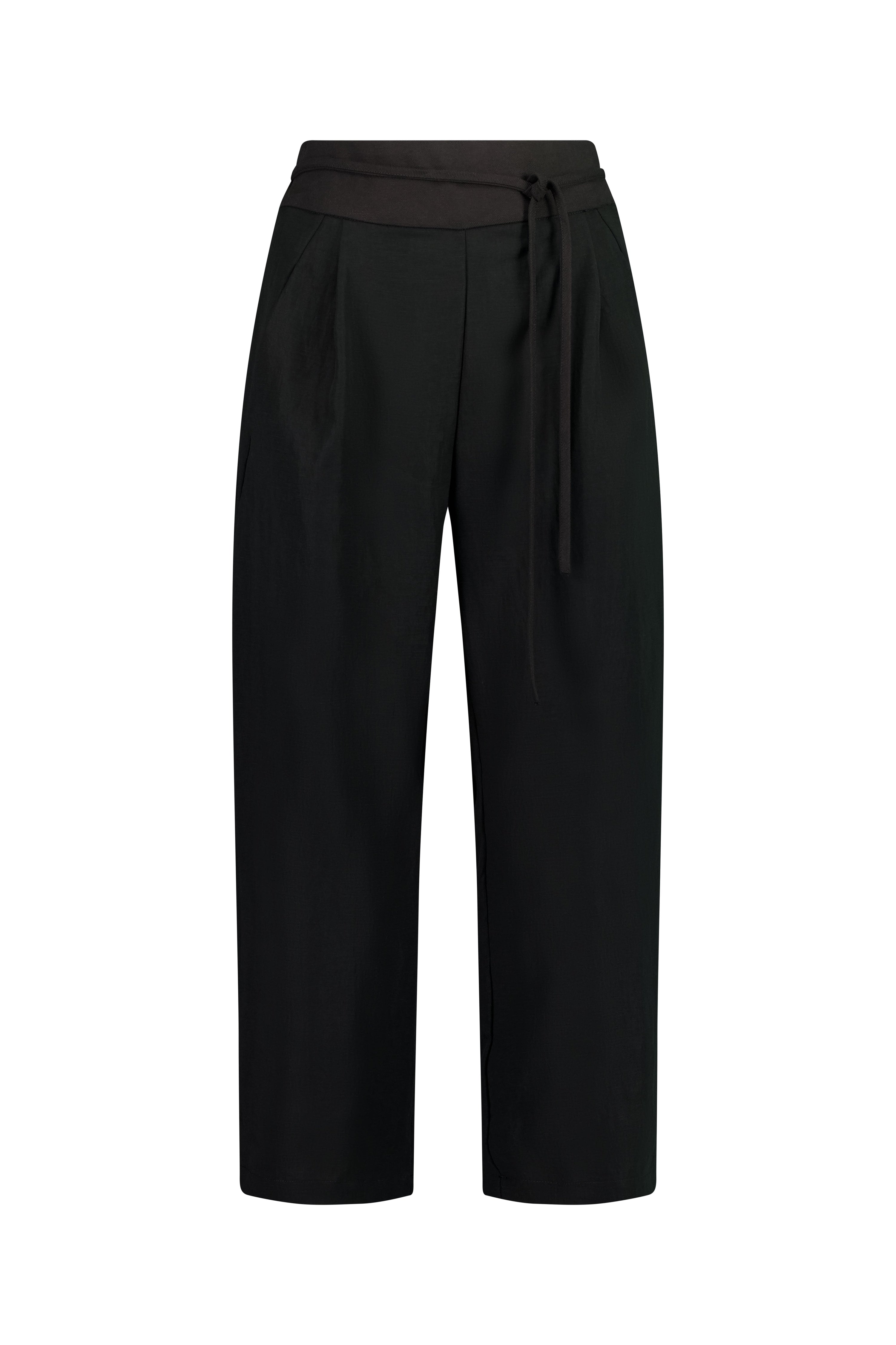 The Poise Pant by Racket — a tailored capri pant with adjustable hem, double pleats, and hidden comfort. Pair with the Siren Cape for modern suiting. NZ Made.