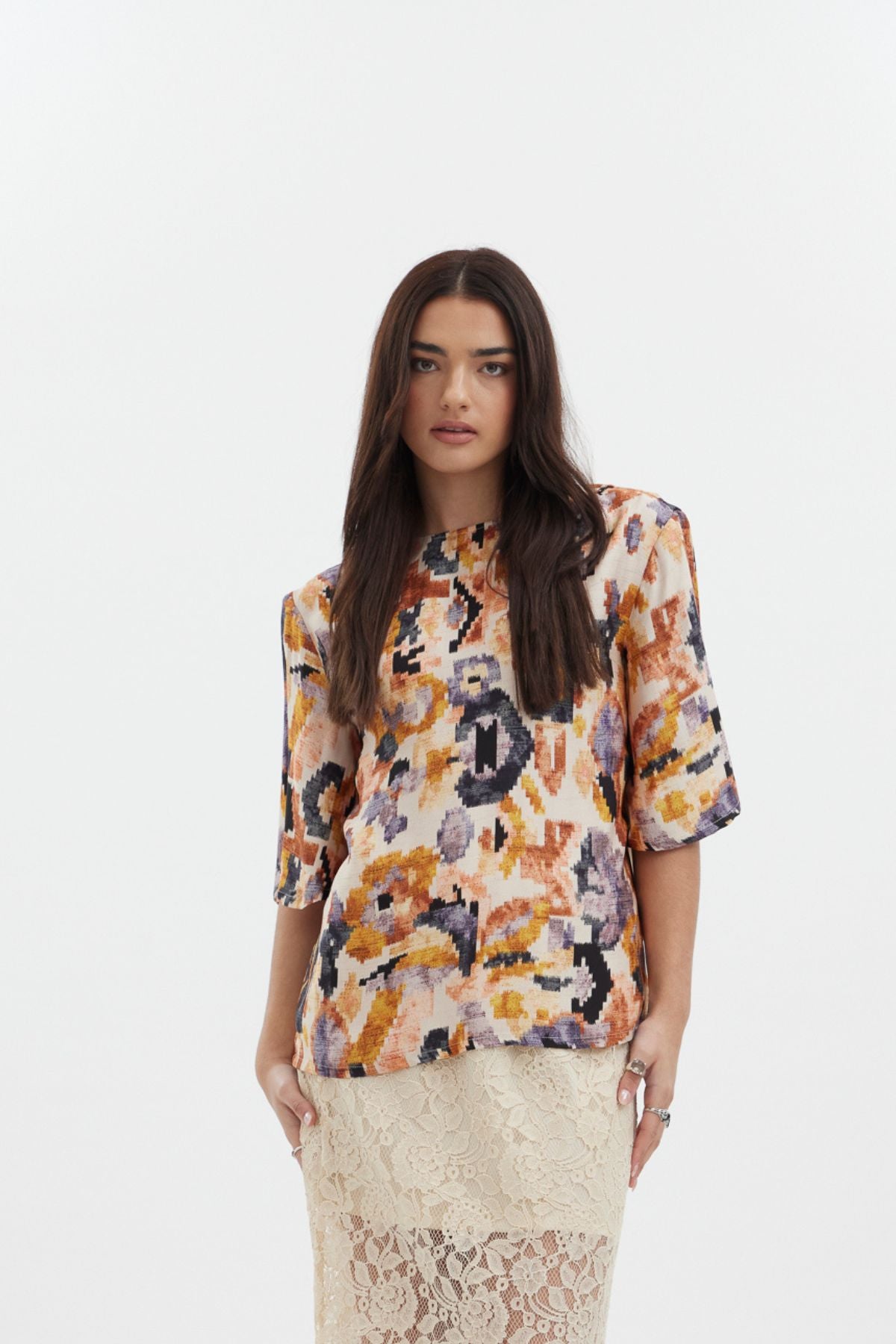 The Dylan Top by racket - a reversible crew and V-neck top in an Aztec-inspired rayon satin print with floaty sleeves. Designed and made in NZ.