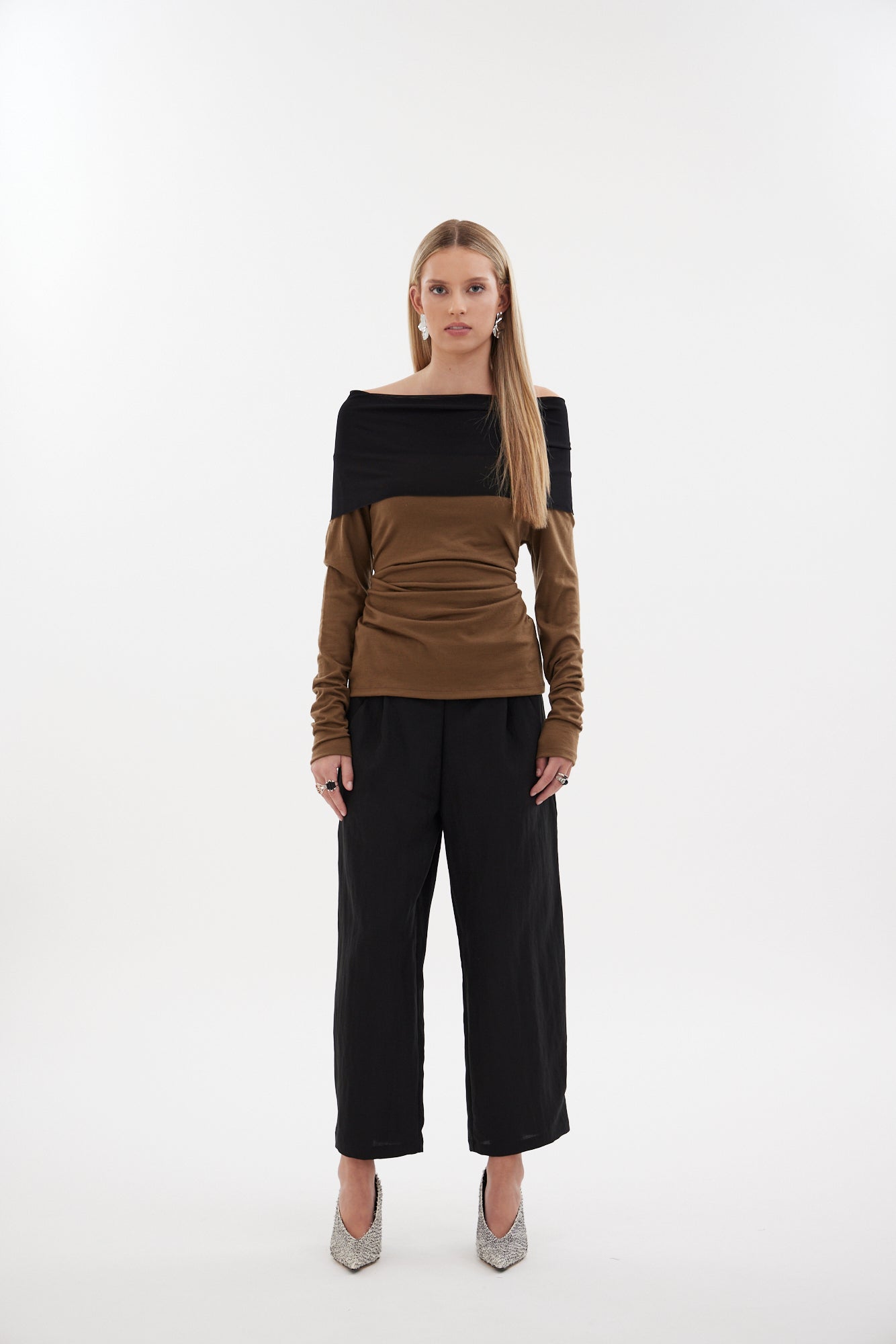 The Poise Pant by Racket — a tailored capri pant with adjustable hem, double pleats, and hidden comfort. Pair with the Siren Cape for modern suiting. NZ Made.
