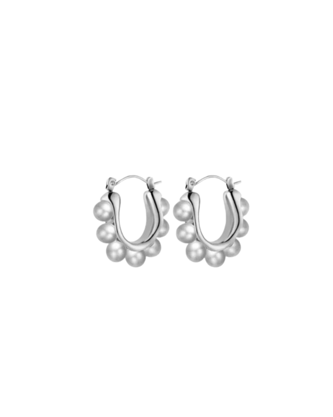Margot Earrings by Castel & Co feature a softly sculpted gold-plated stainless steel hoop finished with a luminous imitation pearl drop. Designed to feel both modern and timeless, they bring a refined edge to everyday styling while also suiting occasion wear. Measuring 2.4 x 2.6 cm with a secure hinge closure. Lightweight (10g), waterproof, and hypoallergenic.