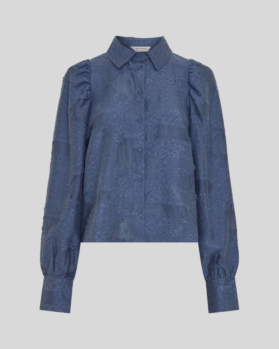 A refined wardrobe essential, the MSCH Orkidea Shirt is crafted from a lightweight fabric with a subtle texture that adds an elegant, elevated feel. Designed in a classic regular fit, it features a timeless shirt collar, full button closure and long sleeves with cuffs.