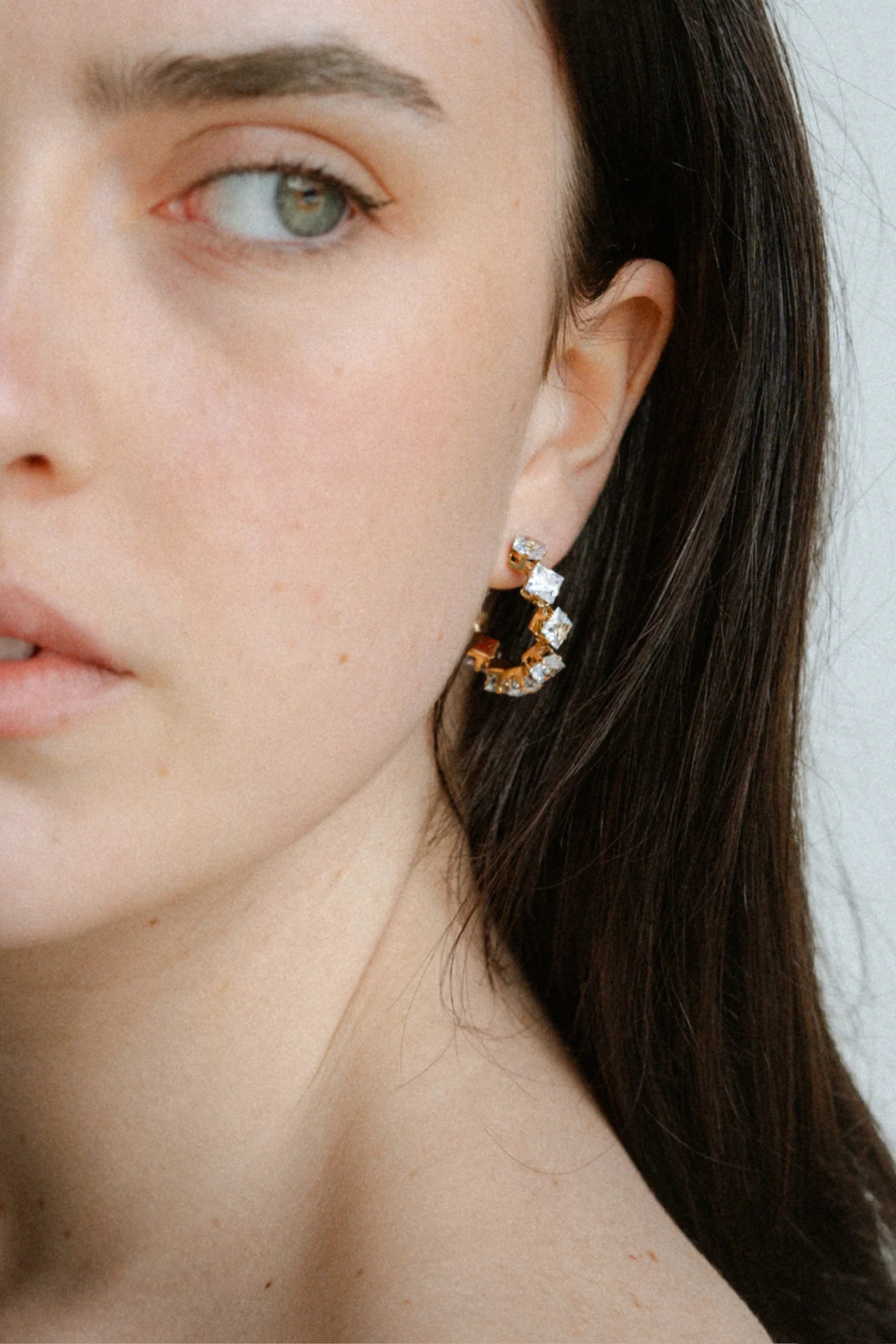Radiant and refined, the Freya Hoops feature gold-plated bands set with sparkling cubic zirconia. Their circular silhouette offers just the right amount of drama, catching the light beautifully from every angle. A modern statement hoop that pairs timeless elegance with contemporary shine.