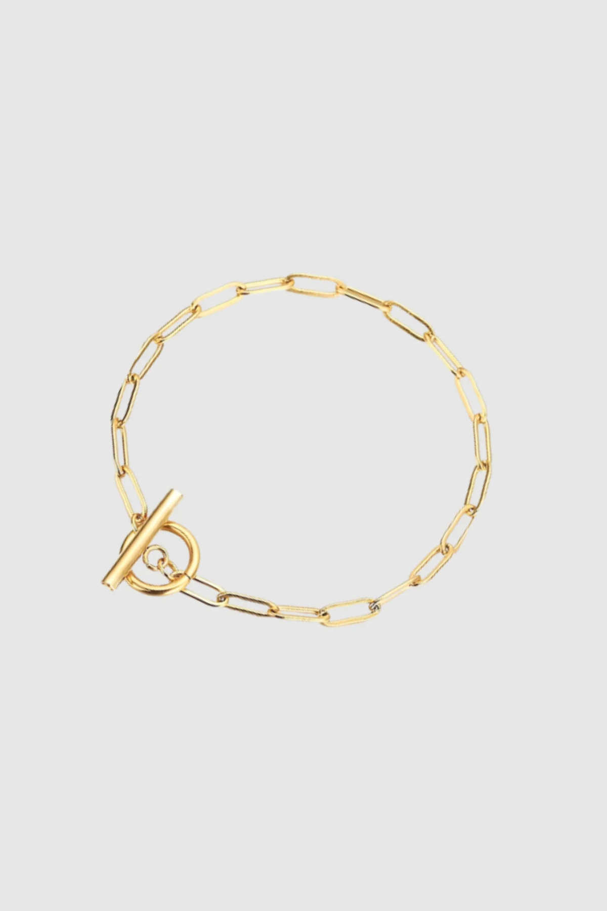 Effortlessly chic and endlessly versatile, the Ava Bracelet features a gold-plated paperclip chain, offering a modern take on a timeless classic. Its sleek, minimalist design makes it perfect for layering or wearing solo as a subtle statement. Whether dressed up or down, this piece adds an elegant edge to any look—a must-have staple for every jewellery collection.

Material: Gold plating, Stainless steel
Bracelet Length: 19 cm
Bracelet Width: 0.4 cm
Waterproof and hypoallergenic
Weight: 5 g