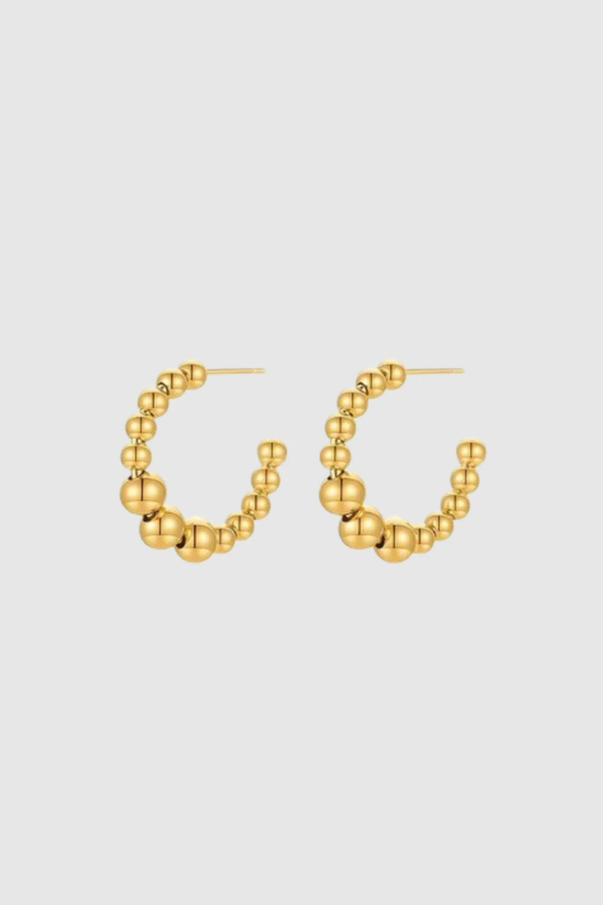 CASTEL & CO
The Bubble Hoops are a playful yet sophisticated take on the classic hoop earring, featuring smooth, rounded details that add texture and dimension to any look. Their gold-plated finish makes them effortlessly versatile, whether you’re dressing up or down.