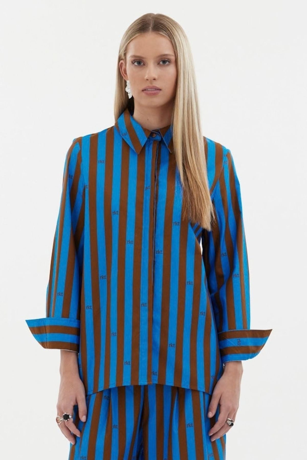 The Icon Shirt by Racket - a relaxed stripe shirt with concealed placket, back yoke pleats and stepped hem. Includes exclusive RKT logo stripe. Made in NZ.