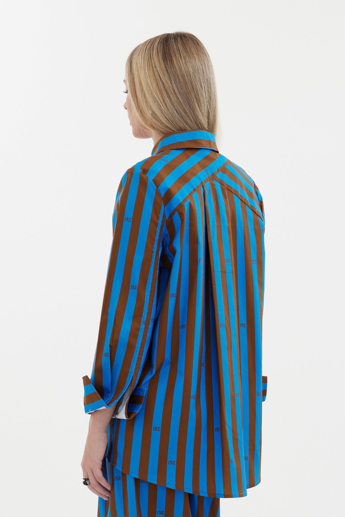 The Icon Shirt by Racket - a relaxed stripe shirt with concealed placket, back yoke pleats and stepped hem. Includes exclusive RKT logo stripe. Made in NZ.