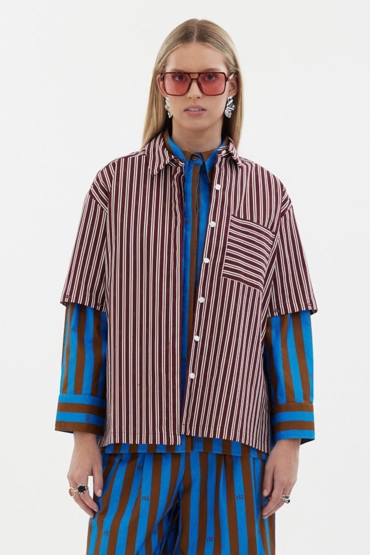 The Icon Shirt by Racket - a relaxed stripe shirt with concealed placket, back yoke pleats and stepped hem. Includes exclusive RKT logo stripe. Made in NZ.