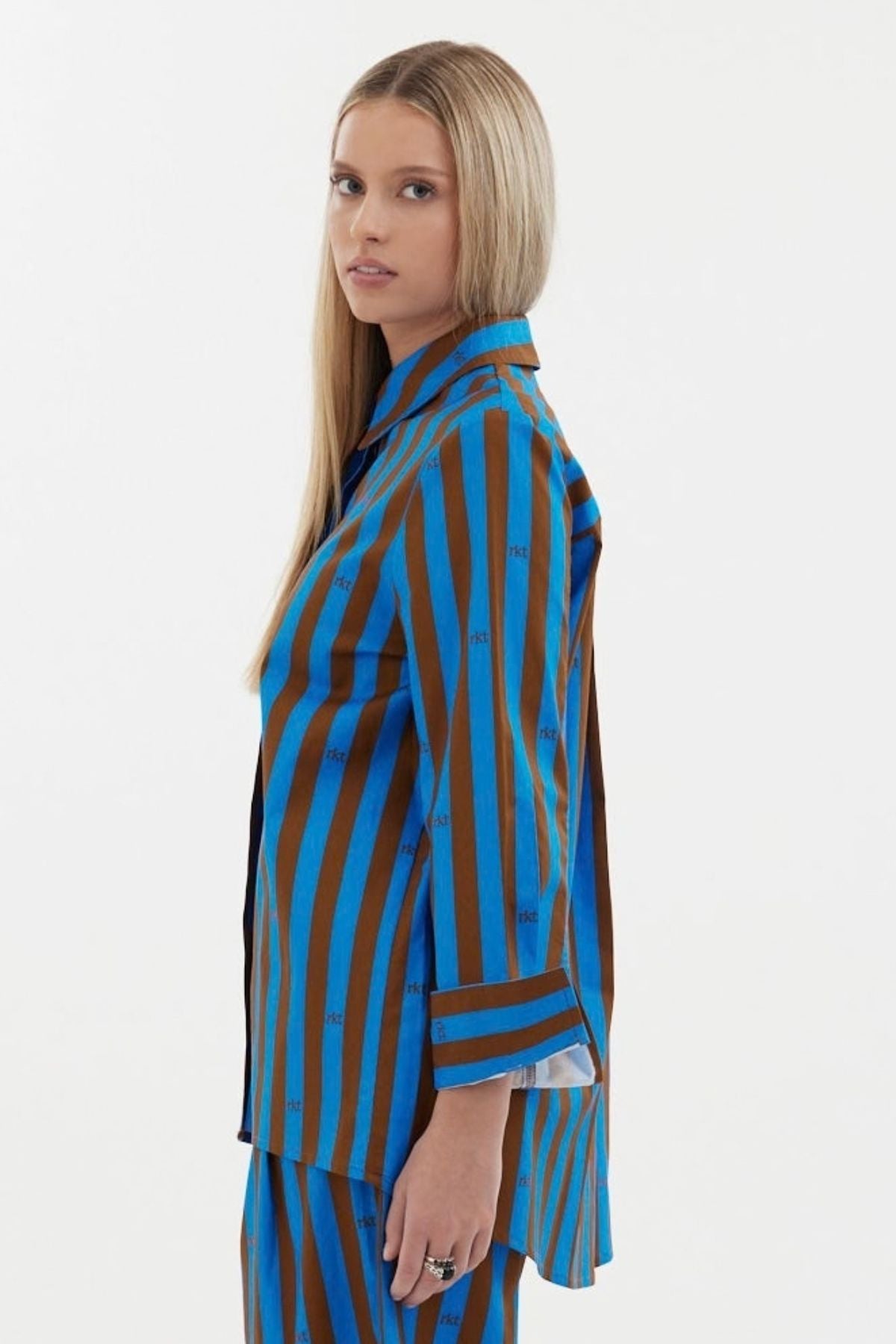 The Icon Shirt by Racket - a relaxed stripe shirt with concealed placket, back yoke pleats and stepped hem. Includes exclusive RKT logo stripe. Made in NZ.
