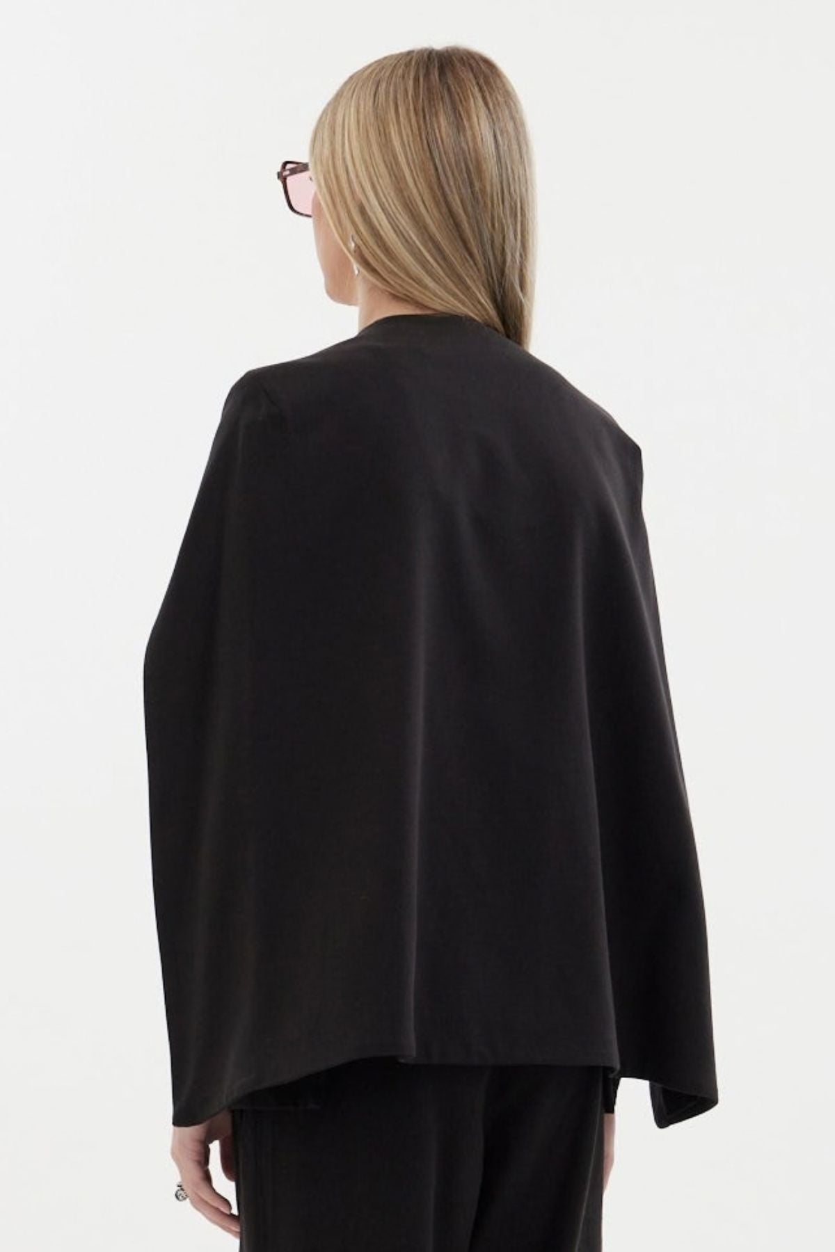 The Siren Cape by Racket - a tailored cape jacket with sleek contrast lapels and subtle shoulder shaping. Style as a suit or with denim. NZ Made.