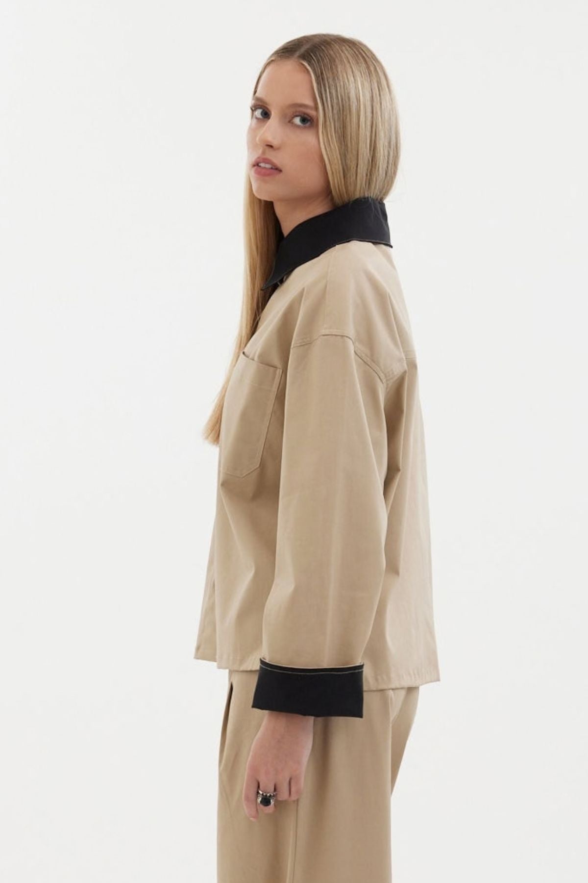 The Motion Shirt by Racket — a cropped, boxy shirt-shacket in cotton lycra with contrast details. Pair with the Motion Pant for a twin set. NZ made.