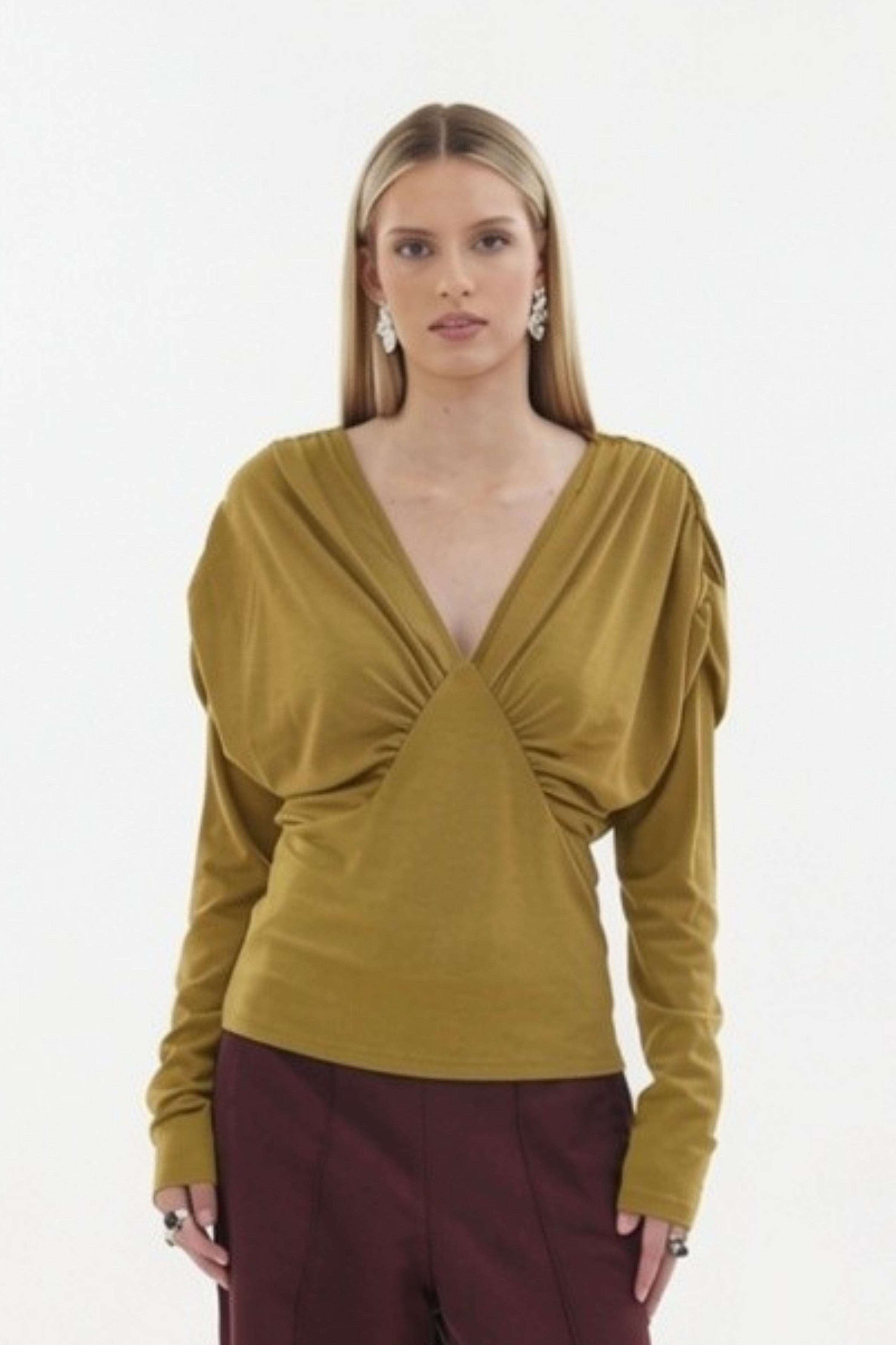The Muse Top by Racket - a 100% merino long sleeve top with V-neck, rouched detailing and sleek sleeves. Refined comfort, made in NZ.