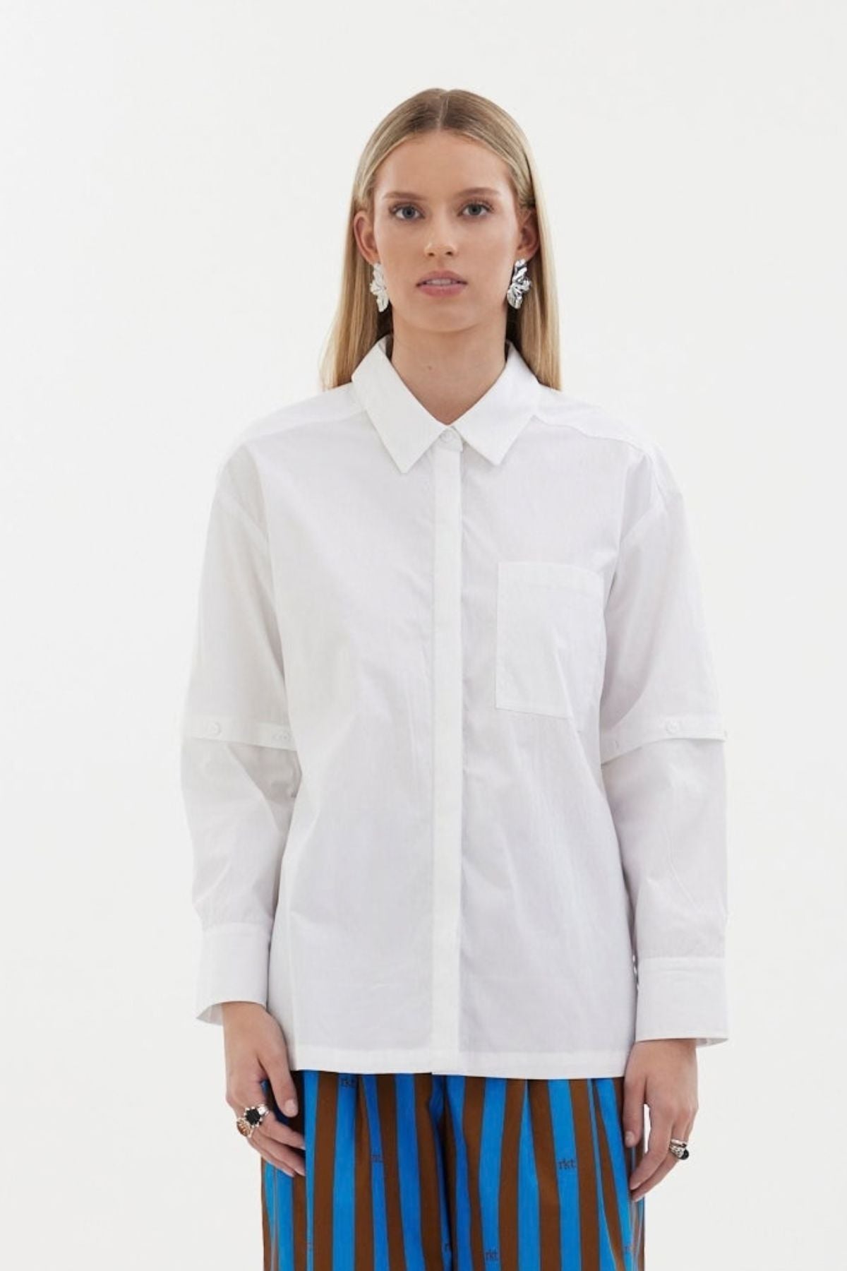 The Rebel Shirt by Racket - a two-in-one shirt with button off sleeves, boxy fit and refined detailing. Available in RKT stripe, white or black. NZ made.