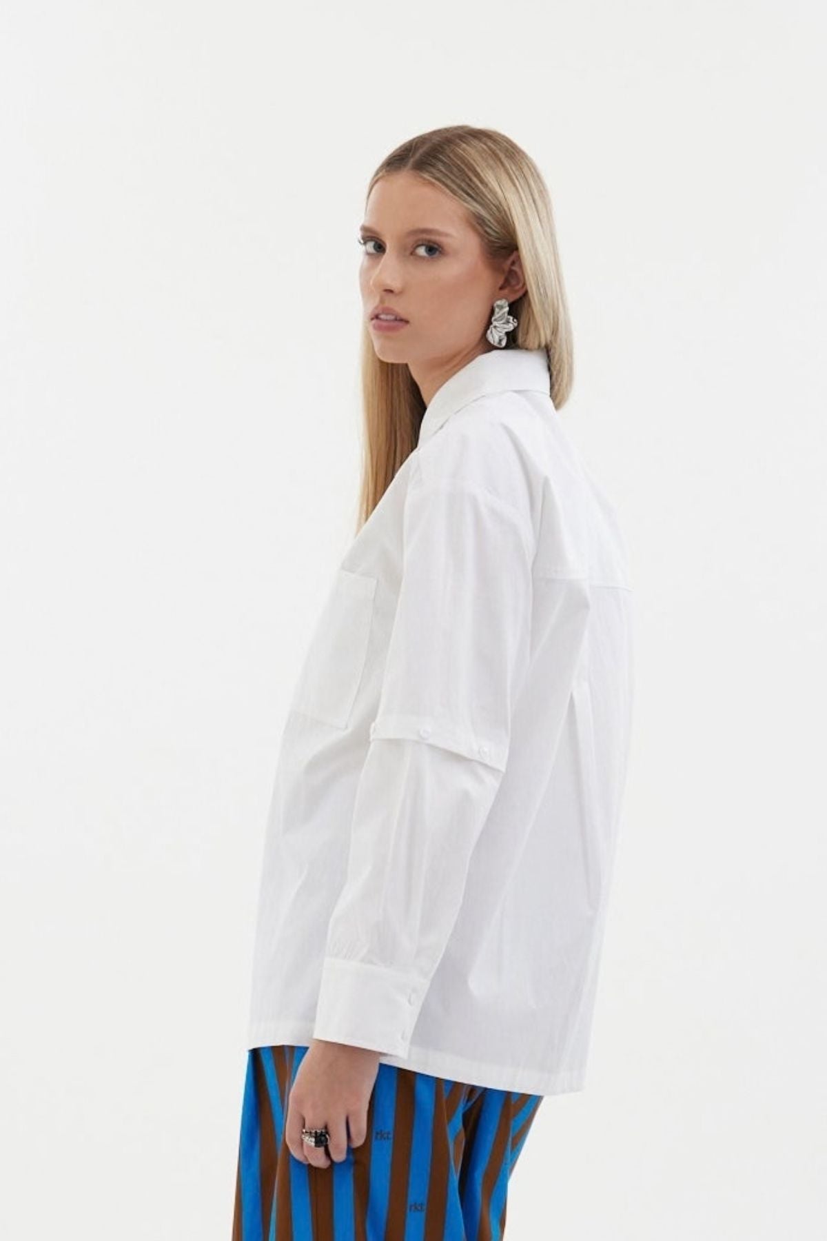 The Rebel Shirt by Racket - a two-in-one shirt with button off sleeves, boxy fit and refined detailing. Available in RKT stripe, white or black. NZ made.