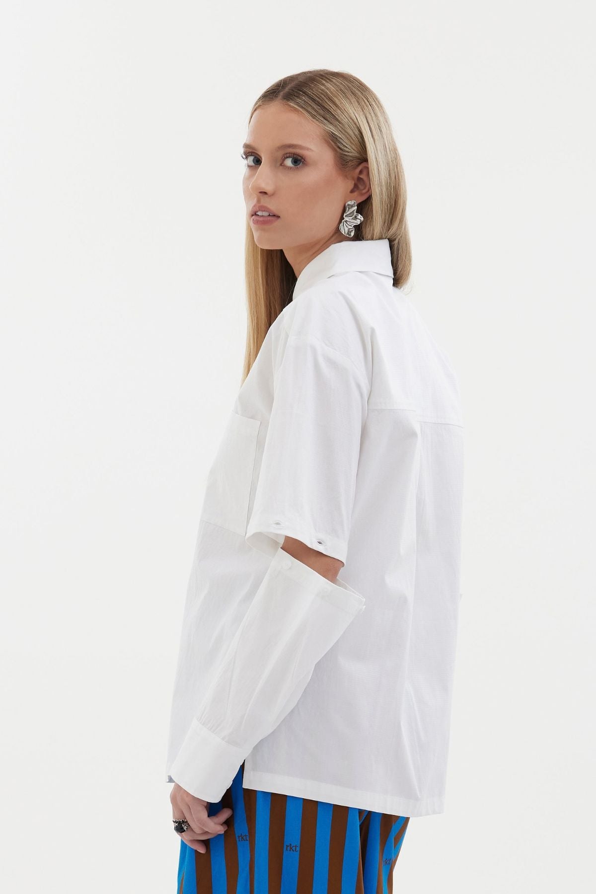 The Rebel Shirt by Racket - a two-in-one shirt with button off sleeves, boxy fit and refined detailing. Available in RKT stripe, white or black. NZ made.