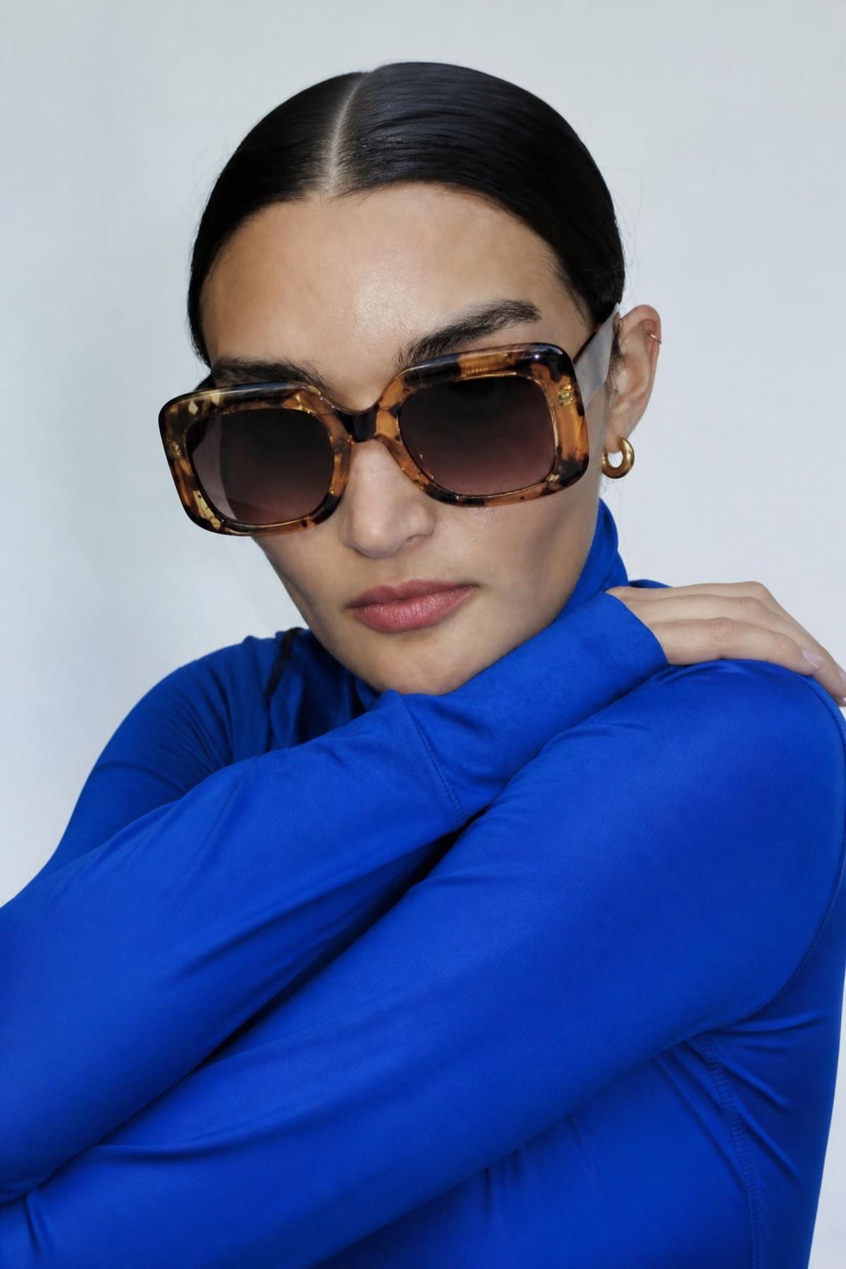 Shop Reality Eyewear Camden Sunglasses at racket - oversized square frames with a chunky sculptural shape, blending retro influence with modern attitude.