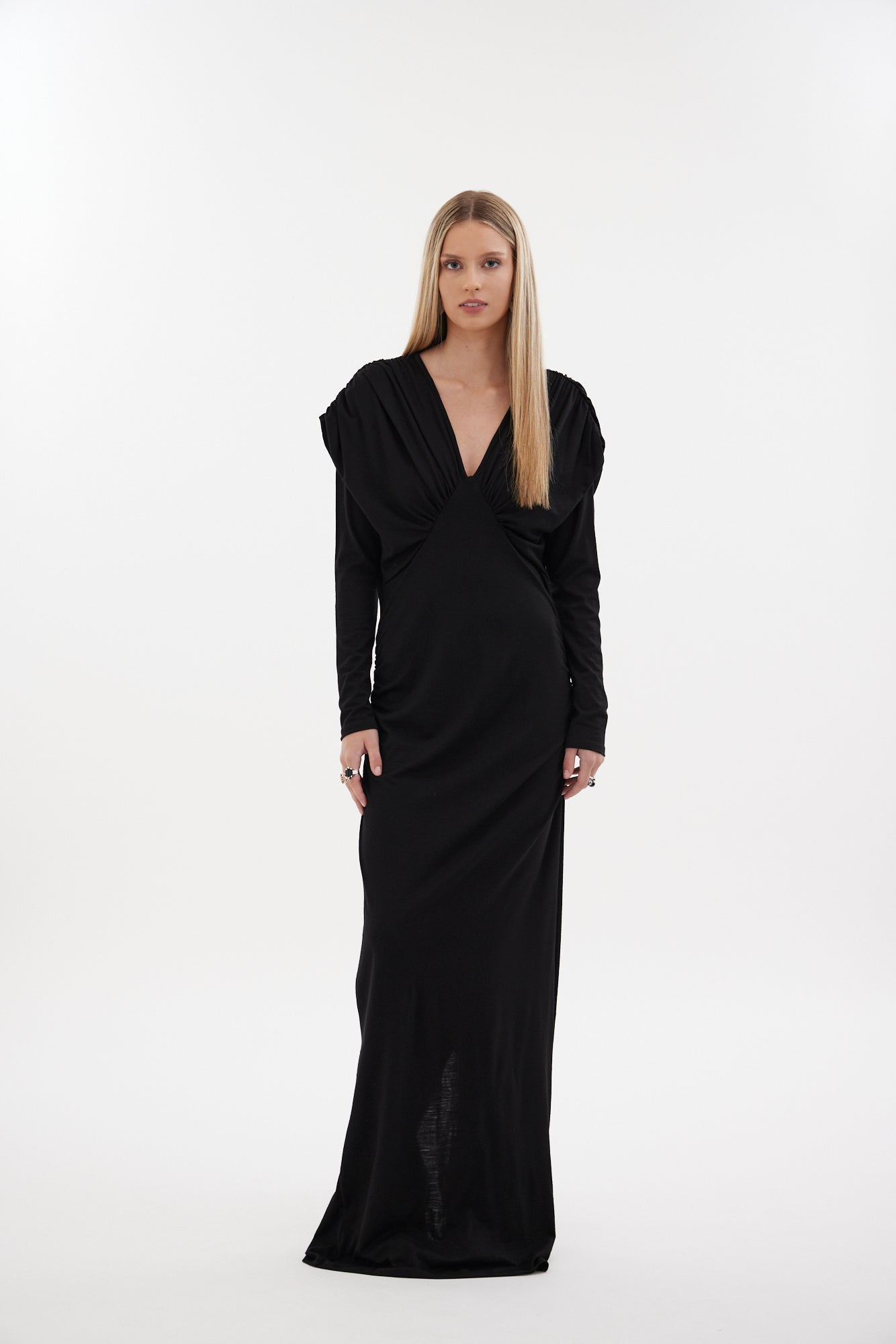 The Muse Dress by Racket - a 100% merino full-length dress with V-neck, rouched detailing and sleek sleeves. Refined comfort, made in NZ.