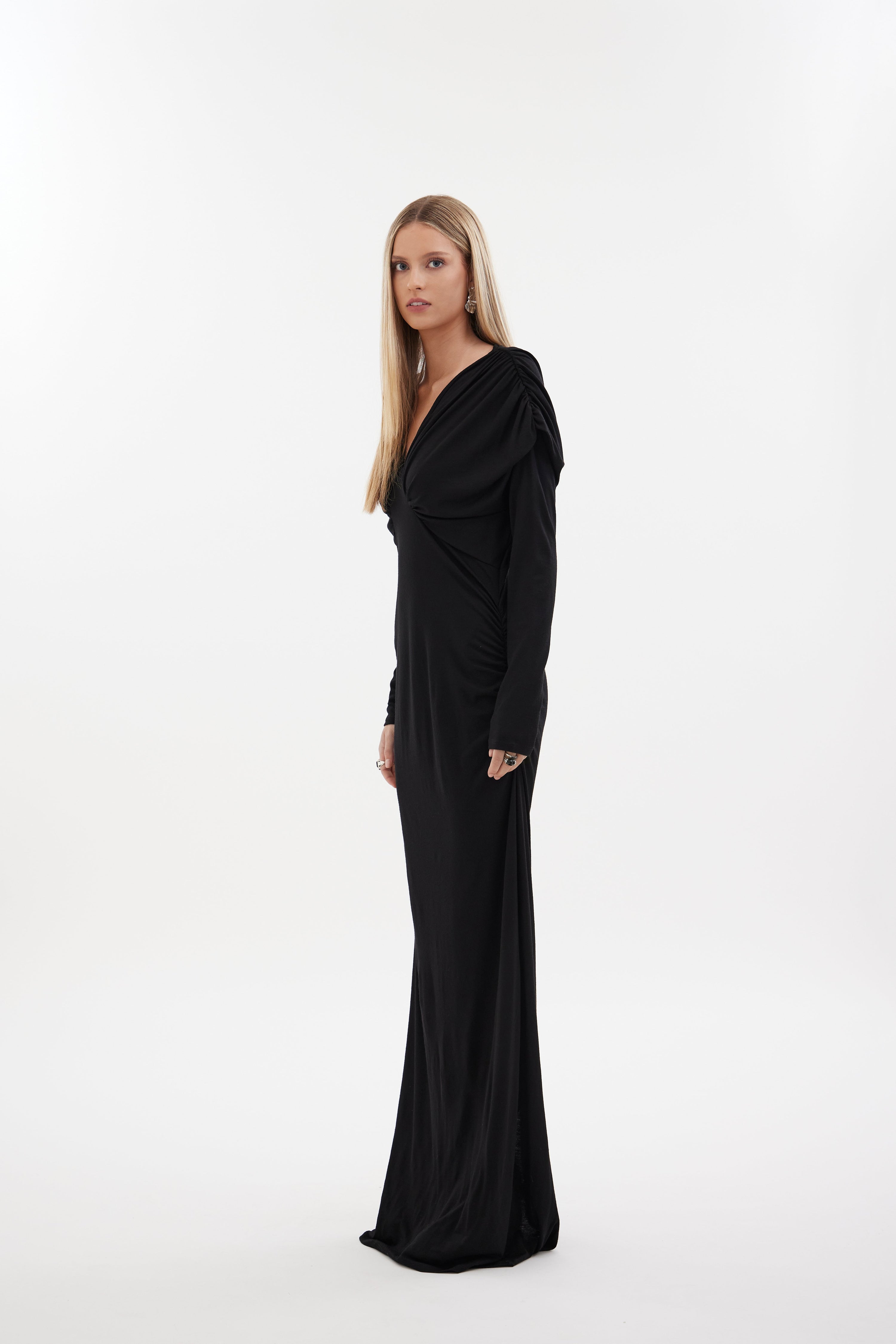 The Muse Dress by Racket - a 100% merino full-length dress with V-neck, rouched detailing and sleek sleeves. Refined comfort, made in NZ.