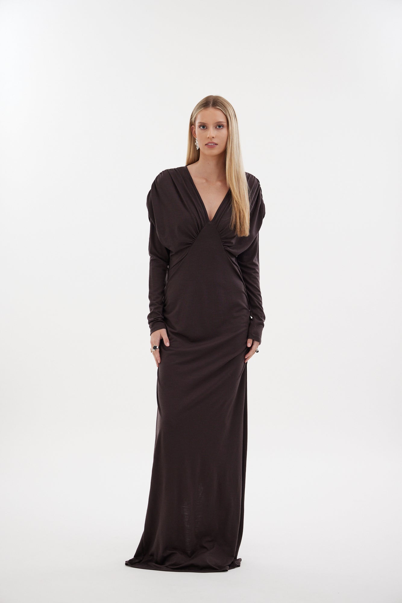 The Muse Dress by Racket - a 100% merino full-length dress with V-neck, rouched detailing and sleek sleeves. Refined comfort, made in NZ.