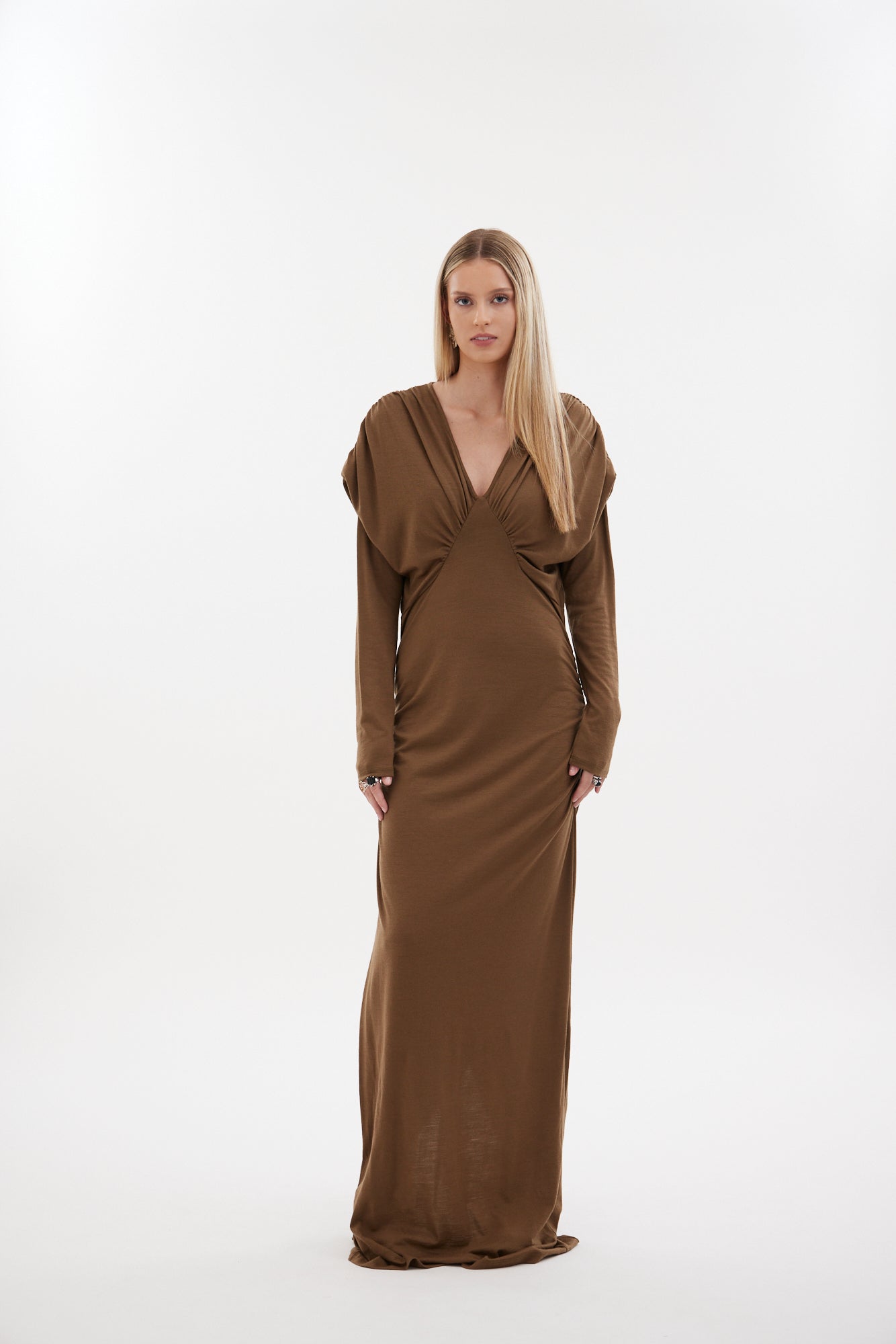 The Muse Dress by Racket - a 100% merino full-length dress with V-neck, rouched detailing and sleek sleeves. Refined comfort, made in NZ.