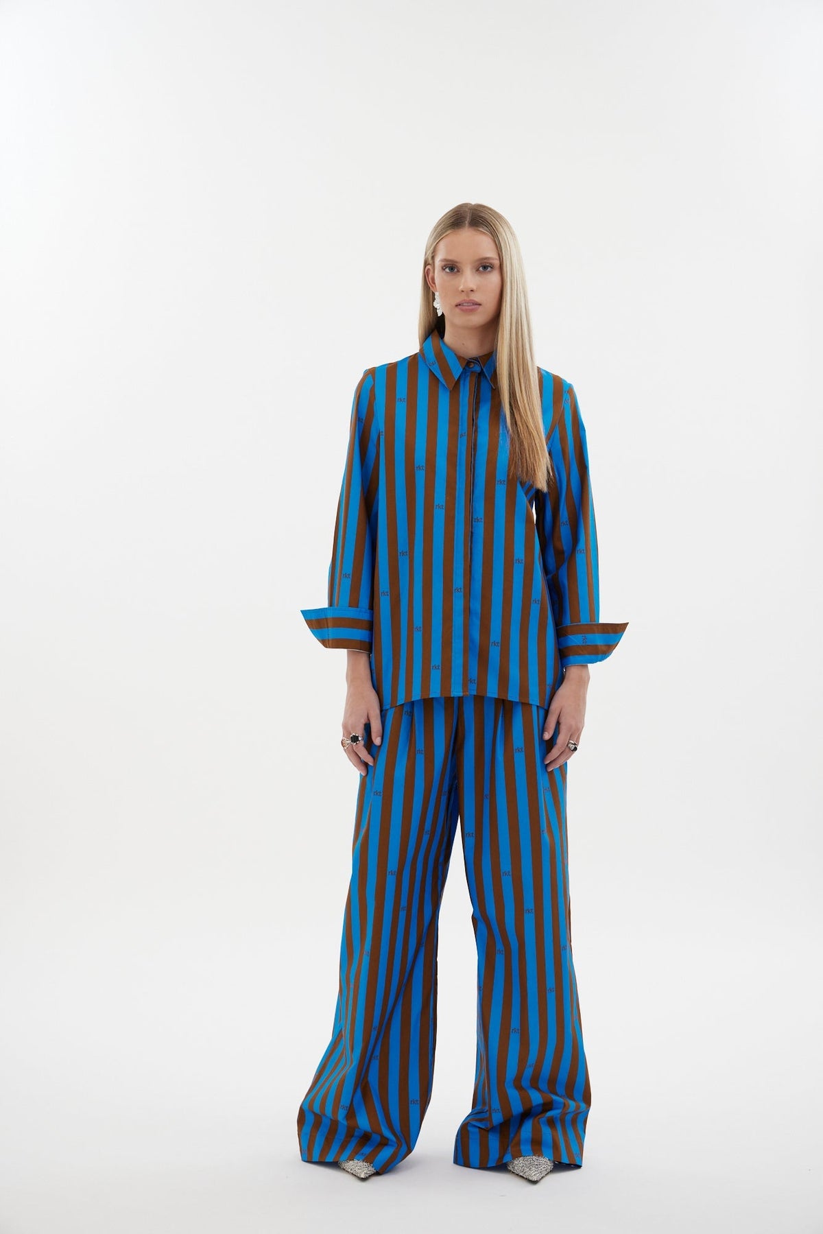 The Icon Shirt by Racket - a relaxed stripe shirt with concealed placket, back yoke pleats and stepped hem. Includes exclusive RKT logo stripe. Made in NZ.