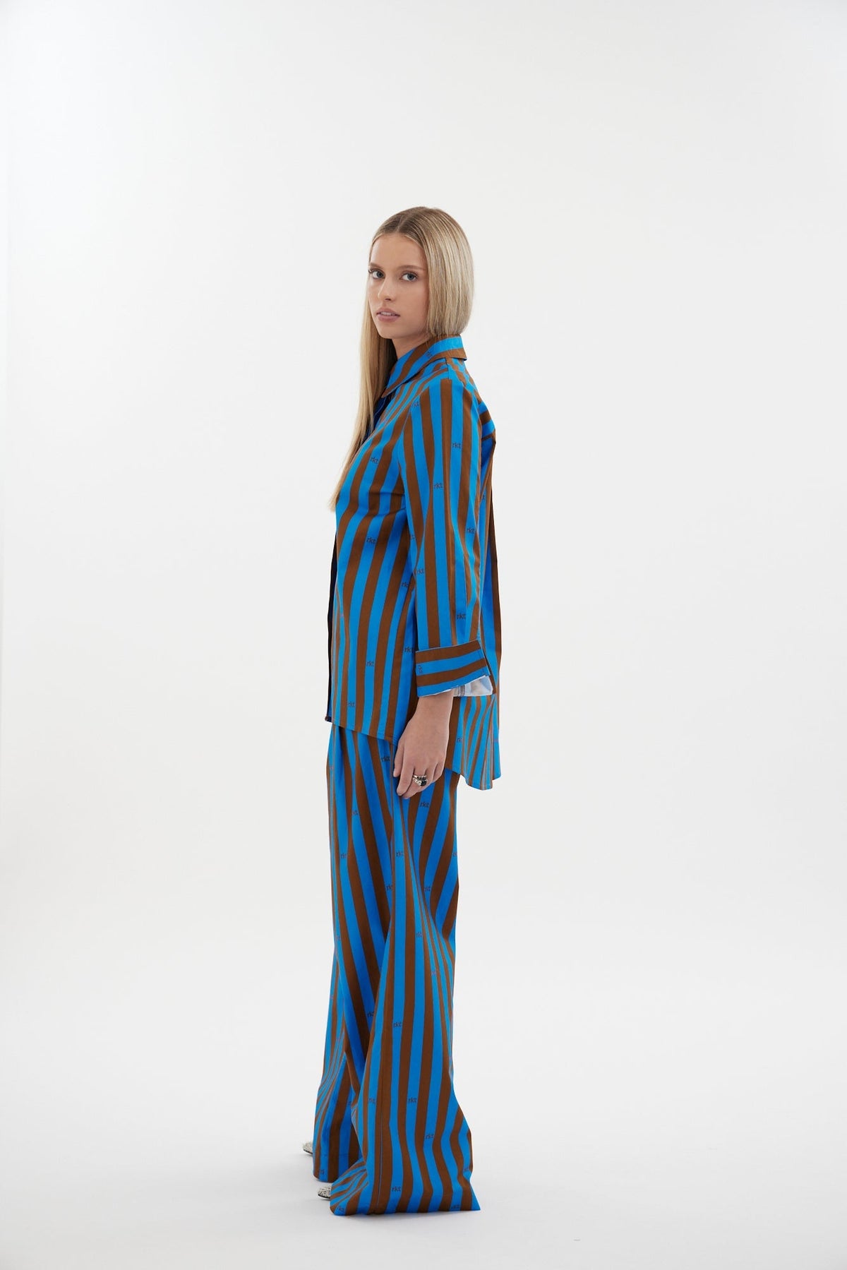 The Icon Shirt by Racket - a relaxed stripe shirt with concealed placket, back yoke pleats and stepped hem. Includes exclusive RKT logo stripe. Made in NZ.
