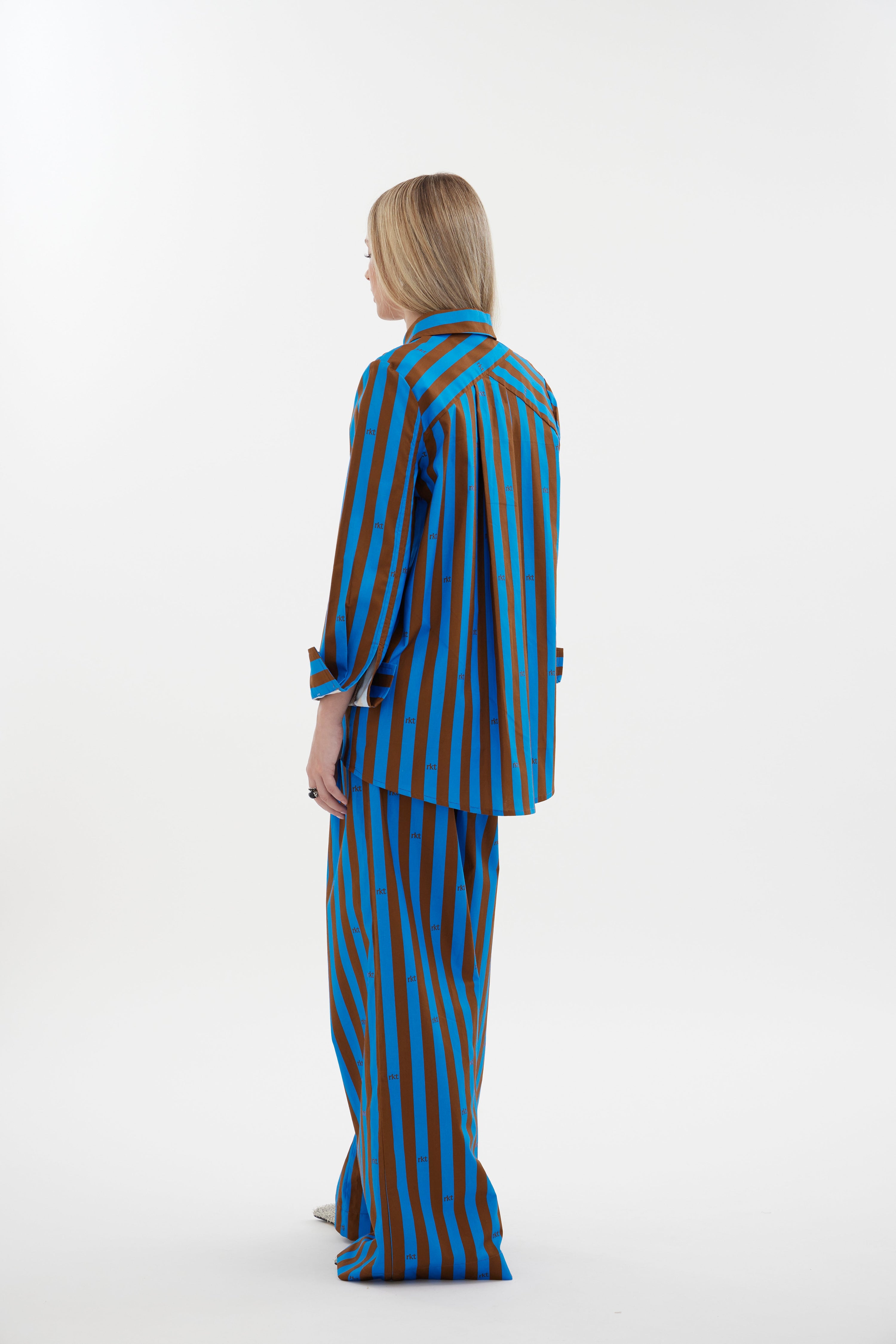 The Icon Shirt by Racket - a relaxed stripe shirt with concealed placket, back yoke pleats and stepped hem. Includes exclusive RKT logo stripe. Made in NZ.