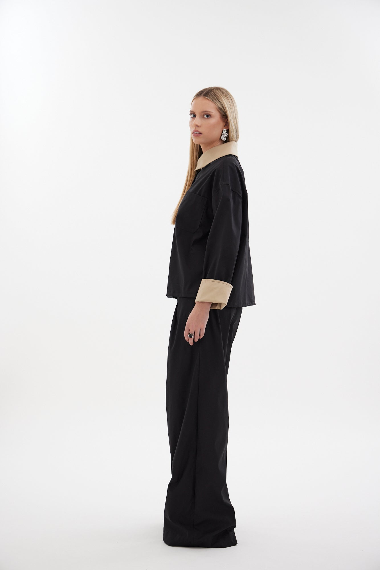 The Motion Pant by Racket — a wide leg cotton pant with double pleats and flexible comfort. Available in black or latte and two inseam lengths. NZ Made.