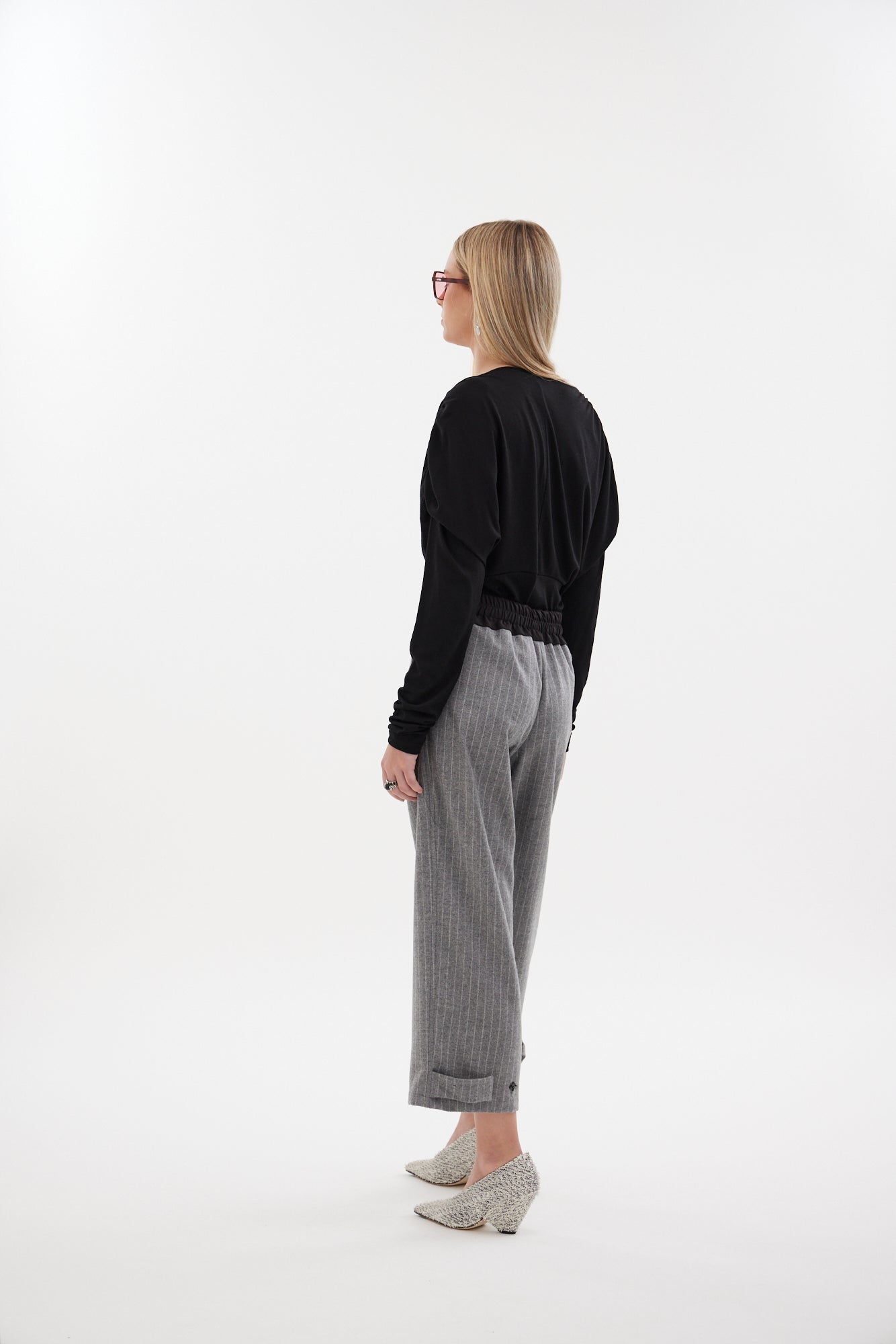 The Muse Top by Racket - a 100% merino long sleeve top with V-neck, rouched detailing and sleek sleeves. Refined comfort, made in NZ.