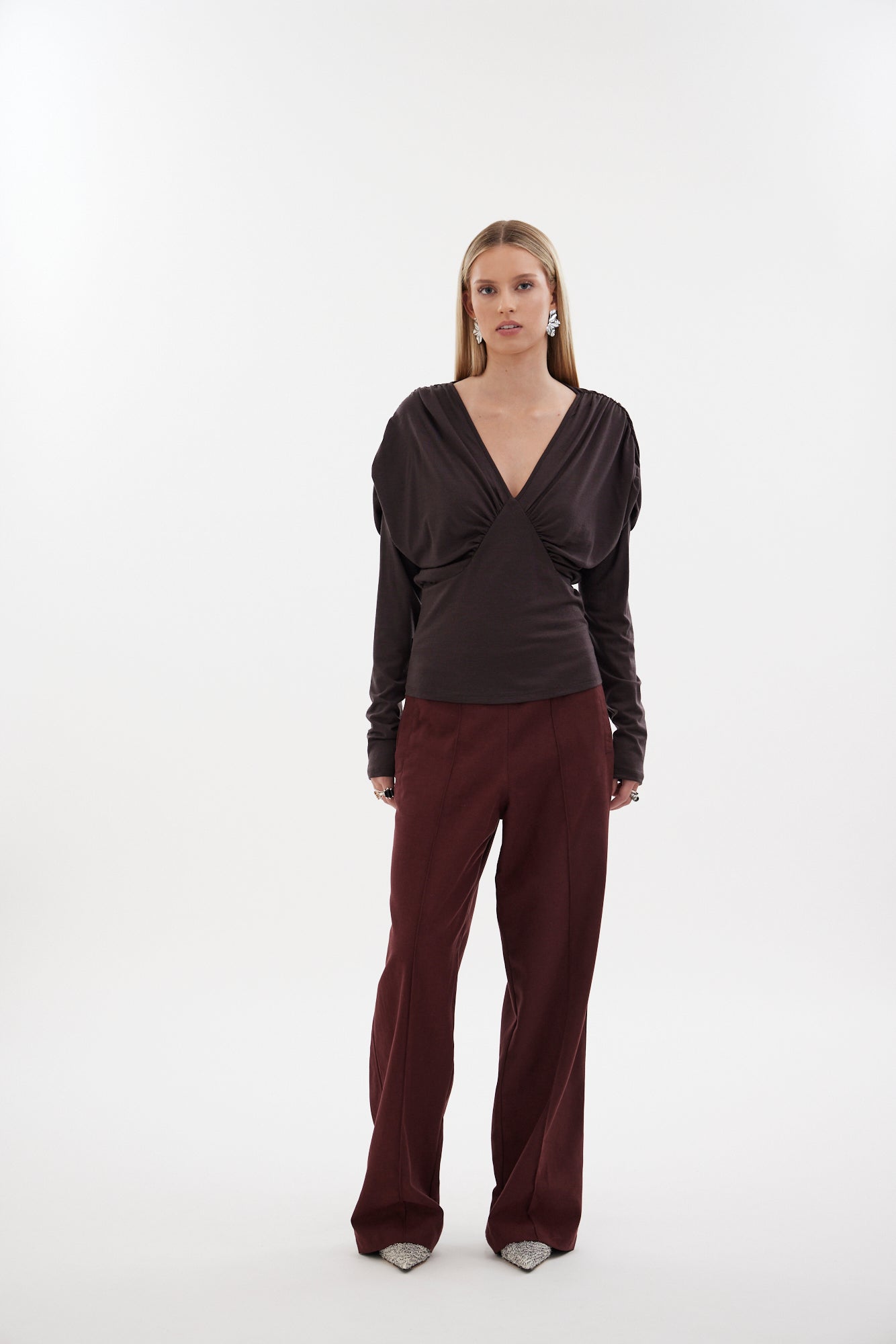 The Muse Top by Racket - a 100% merino long sleeve top with V-neck, rouched detailing and sleek sleeves. Refined comfort, made in NZ.