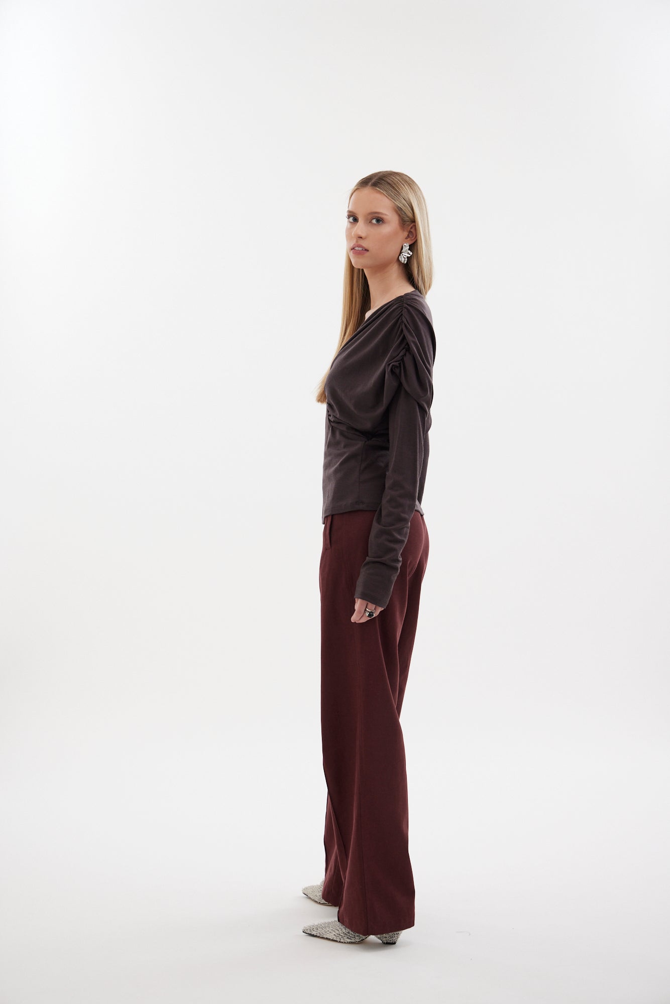 The Muse Top by Racket - a 100% merino long sleeve top with V-neck, rouched detailing and sleek sleeves. Refined comfort, made in NZ.