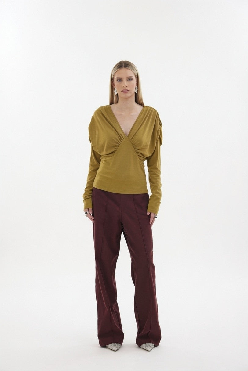 The Muse Top by Racket - a 100% merino long sleeve top with V-neck, rouched detailing and sleek sleeves. Refined comfort, made in NZ.