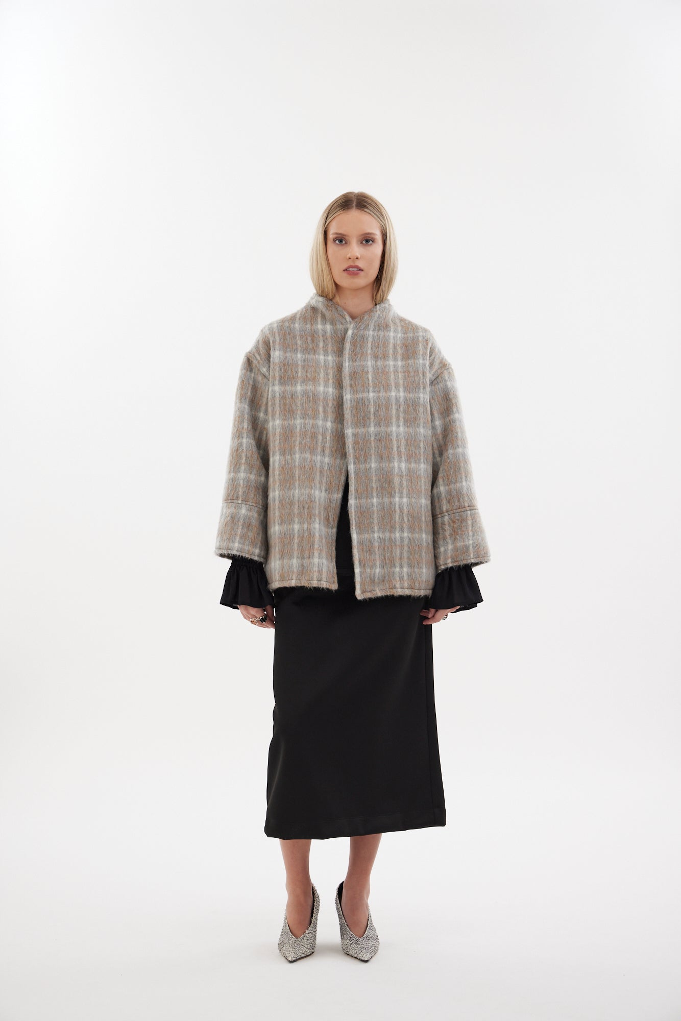 The Pitch Coat by Racket - an upper-thigh wool coat with wide sleeves, flat felled seams and modern mandarin collar. Designed and made in NZ.