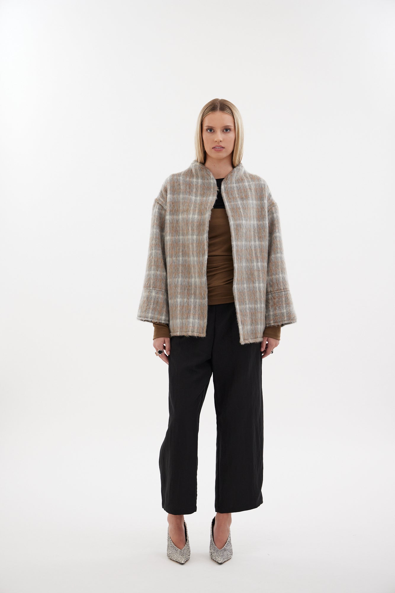 The Pitch Coat by Racket - an upper-thigh wool coat with wide sleeves, flat felled seams and modern mandarin collar. Designed and made in NZ.