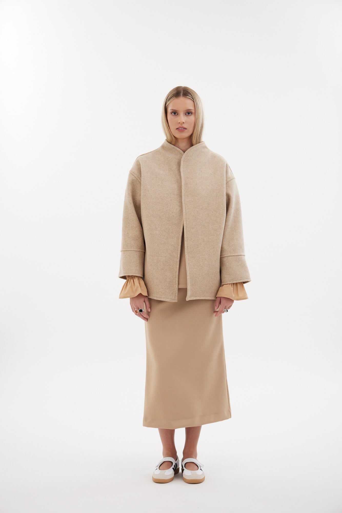 The Pitch Coat by Racket - an upper-thigh wool coat with wide sleeves, flat felled seams and modern mandarin collar. Designed and made in NZ.