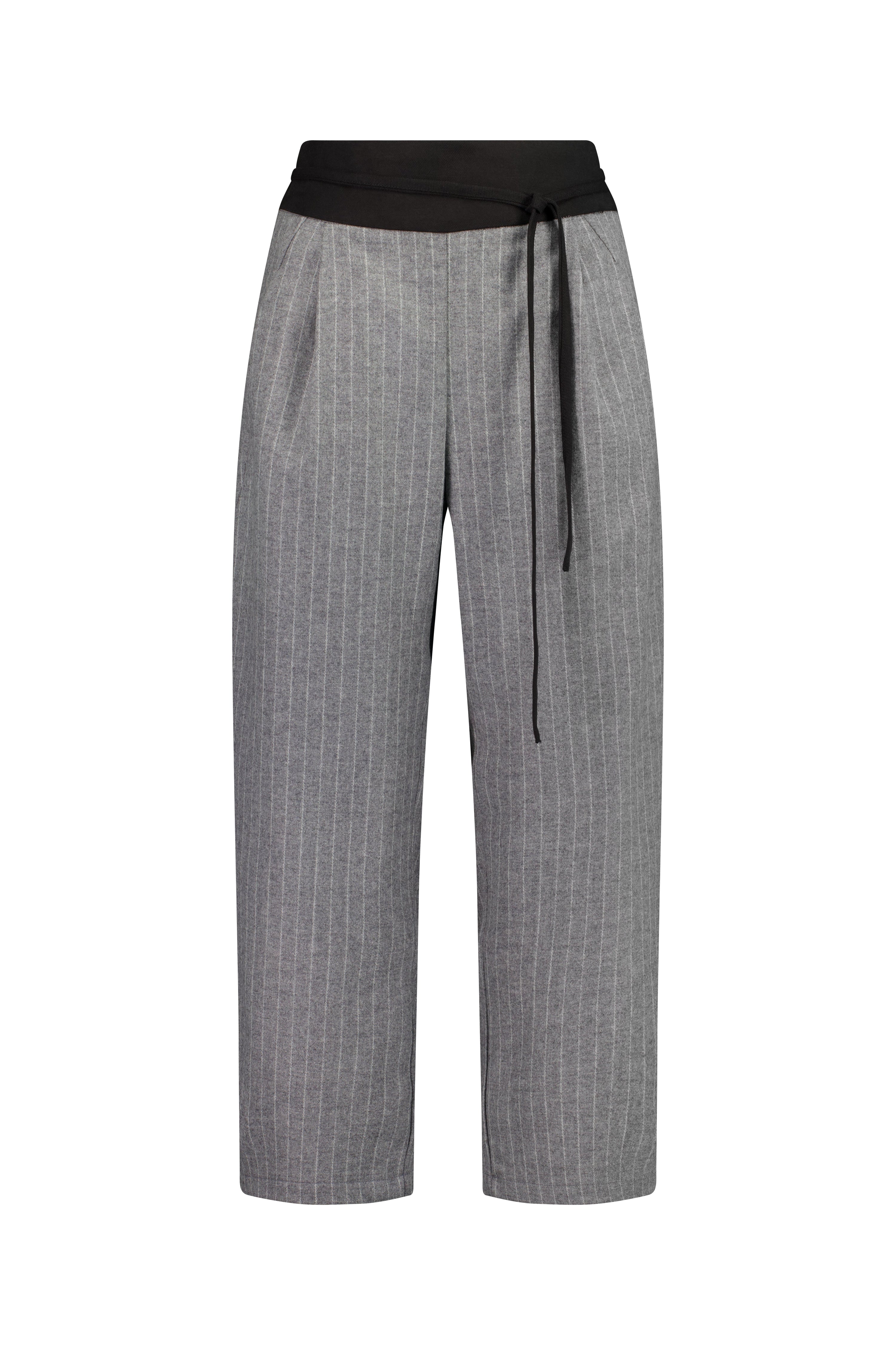 The Poise Pant by Racket — a tailored capri pant with adjustable hem, double pleats, and hidden comfort. Pair with the Siren Cape for modern suiting. NZ Made.