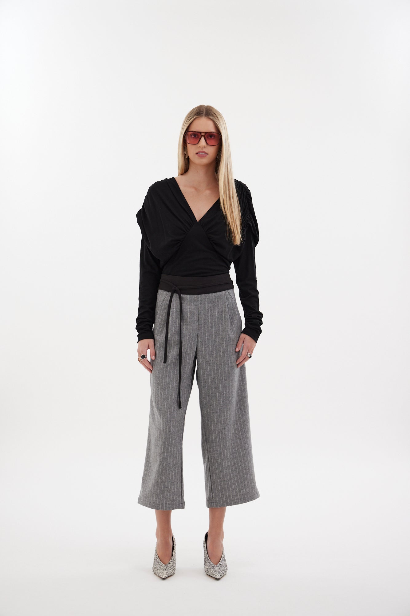 The Poise Pant by Racket — a tailored capri pant with adjustable hem, double pleats, and hidden comfort. Pair with the Siren Cape for modern suiting. NZ Made.