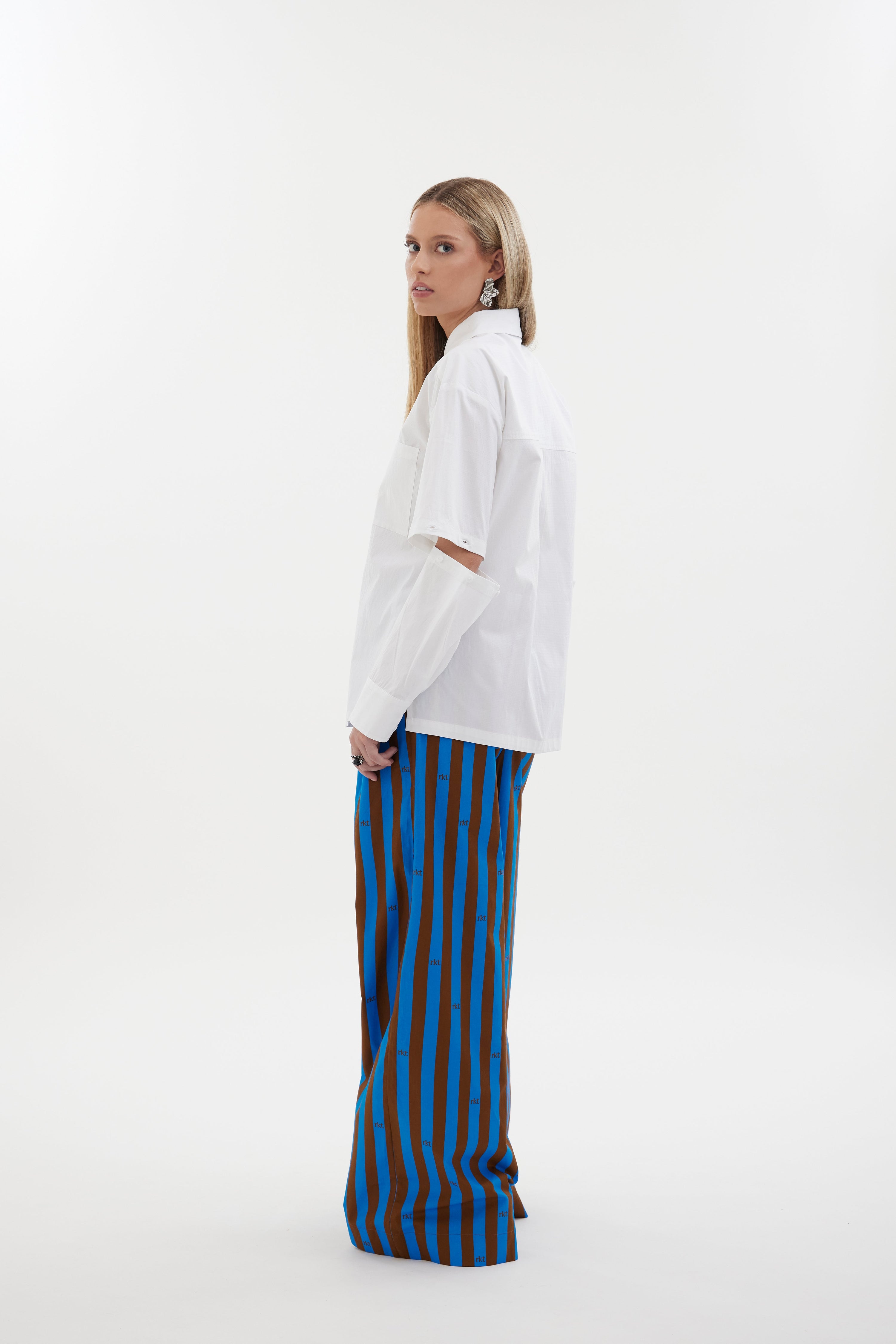 The Rebel Shirt by Racket - a two-in-one shirt with button off sleeves, boxy fit and refined detailing. Available in RKT stripe, white or black. NZ made.