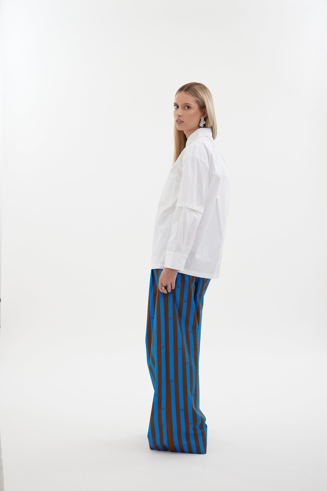 The Rebel Shirt by Racket - a two-in-one shirt with button off sleeves, boxy fit and refined detailing. Available in RKT stripe, white or black. NZ made.