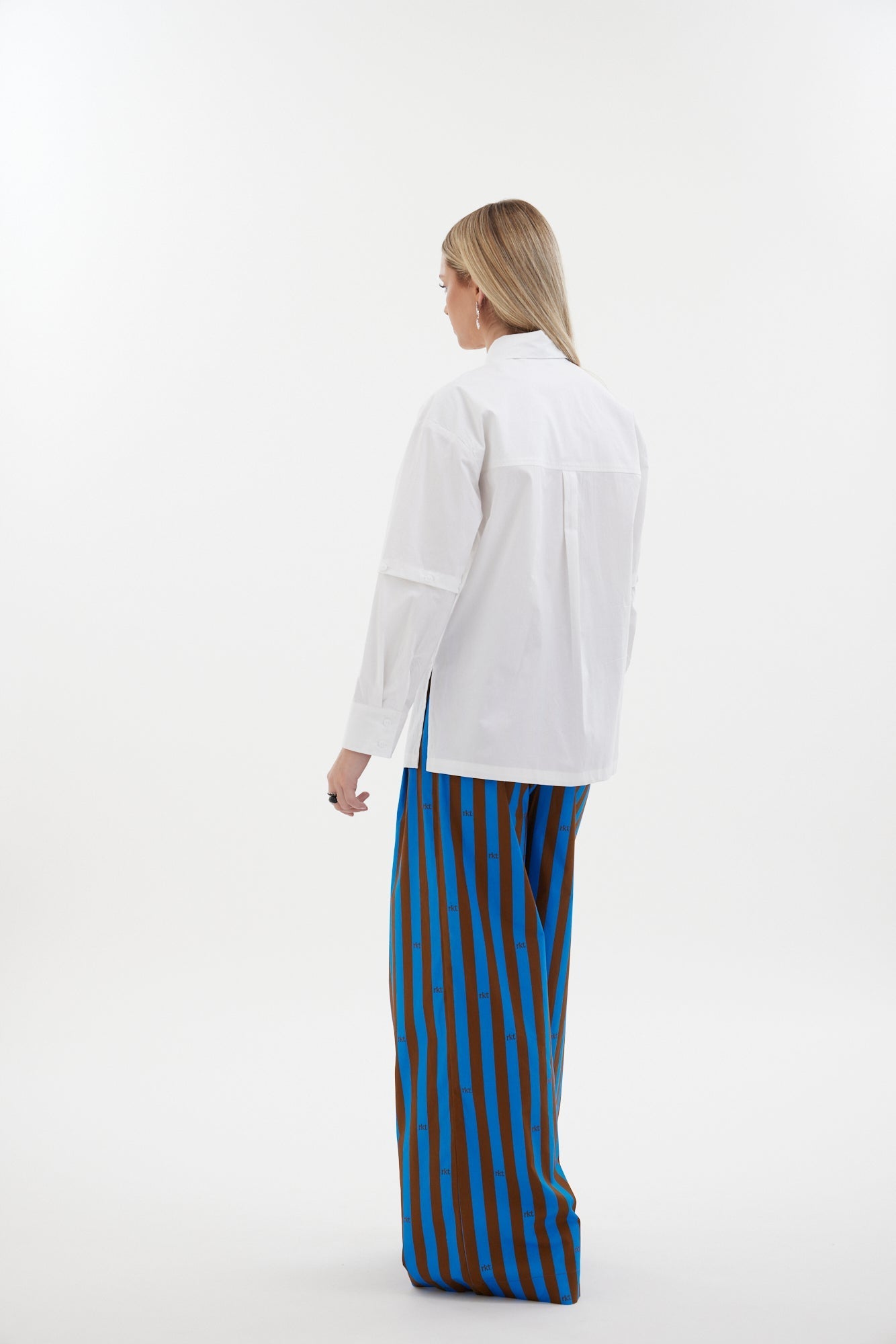 The Rebel Shirt by Racket - a two-in-one shirt with button off sleeves, boxy fit and refined detailing. Available in RKT stripe, white or black. NZ made.