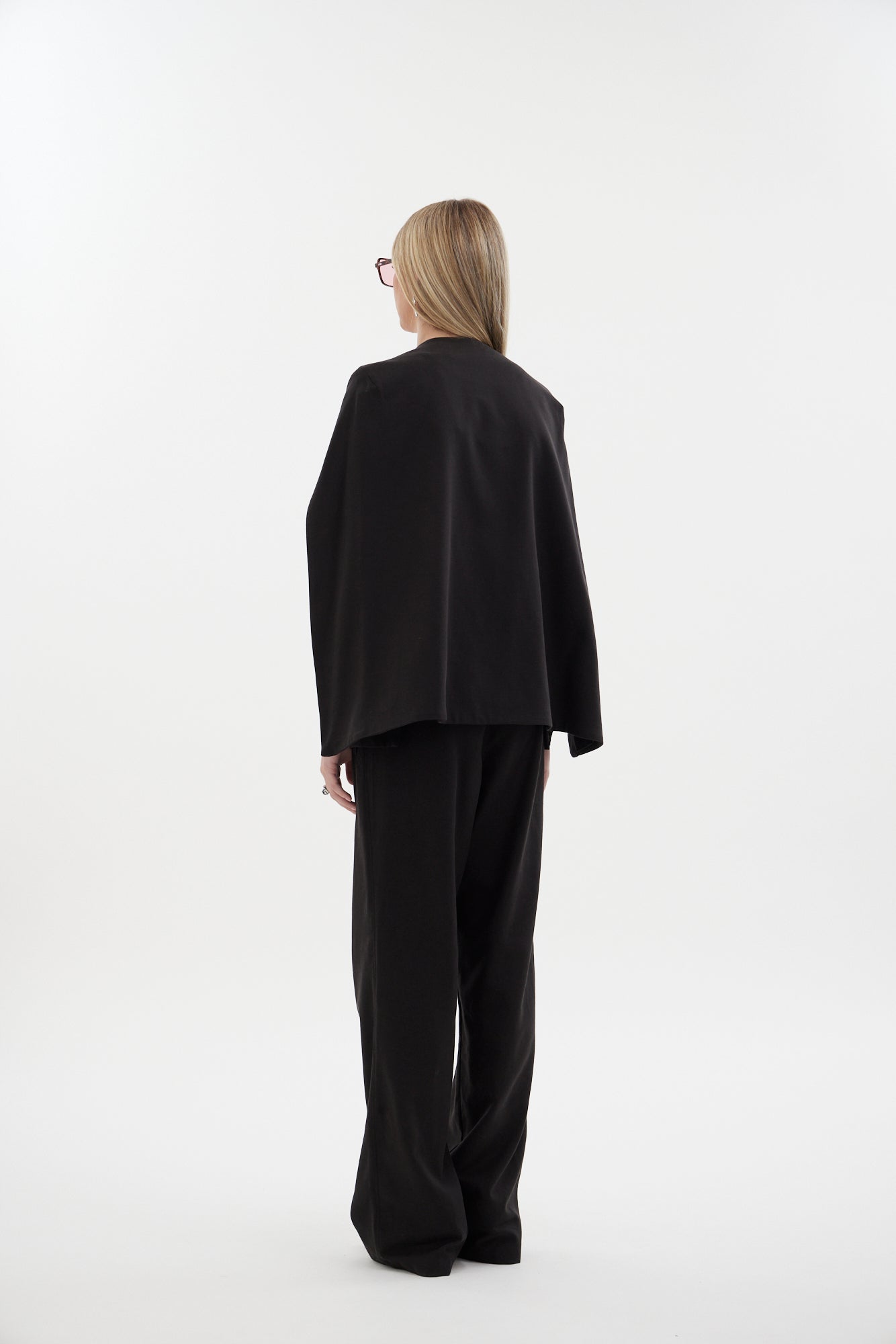 The Siren Cape by Racket - a tailored cape jacket with sleek contrast lapels and subtle shoulder shaping. Style as a suit or with denim. NZ Made.